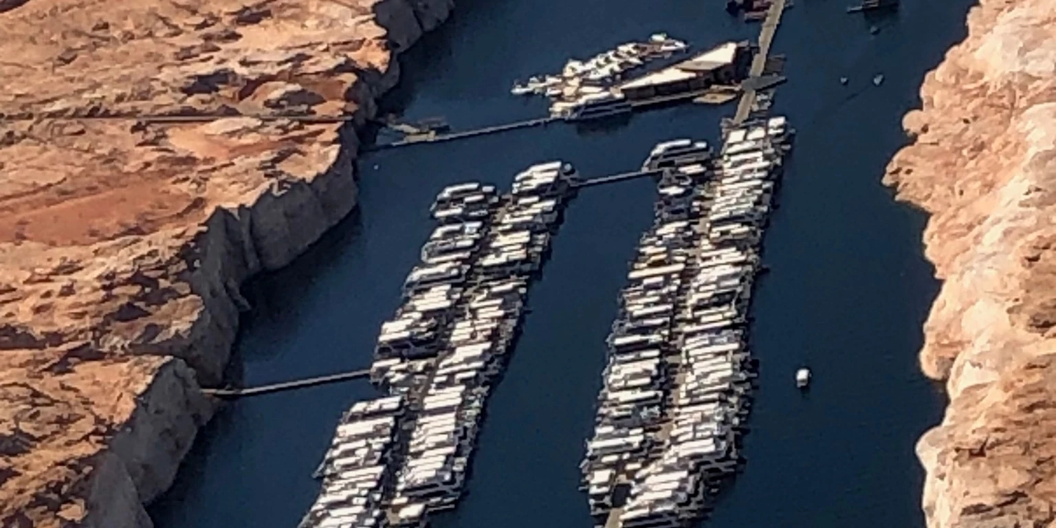 Aerial view of Antelope Point Marina on Lake Powell near Page, Arizona, with houseboats moored in a narrow canyon