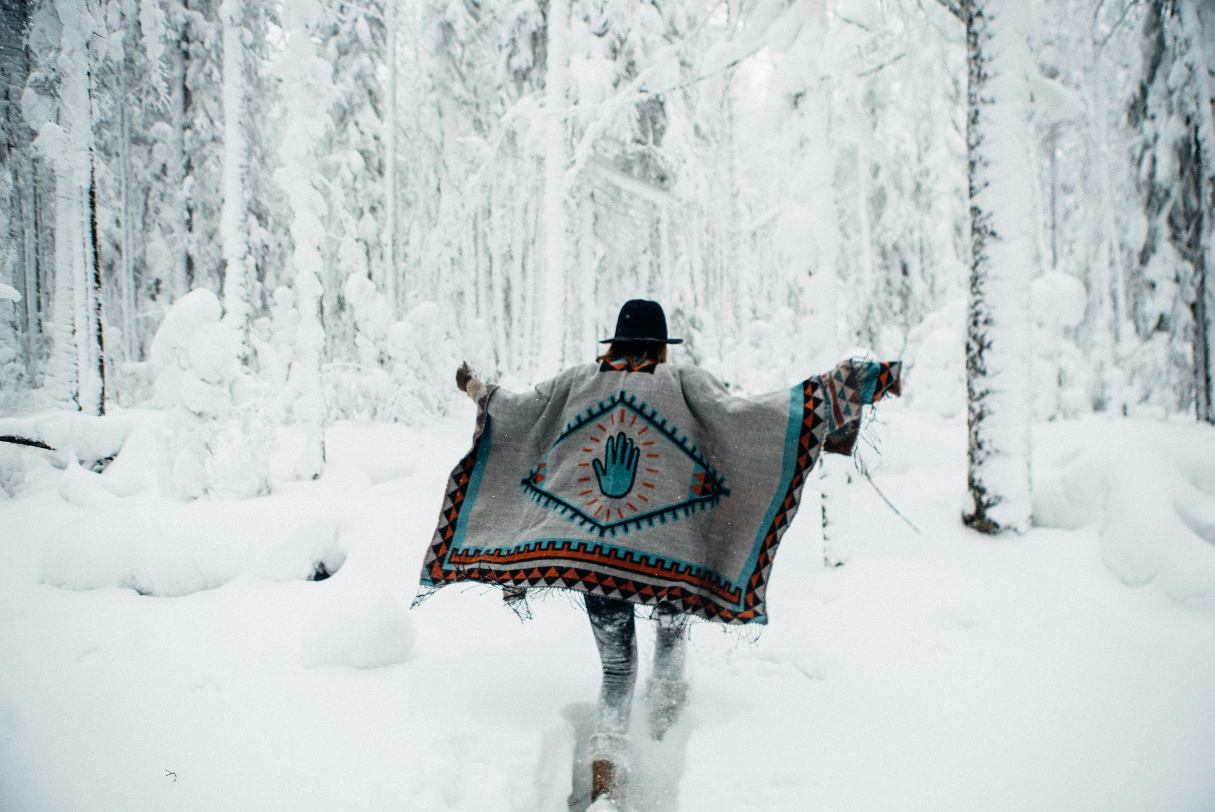 a woman in a snowy forest