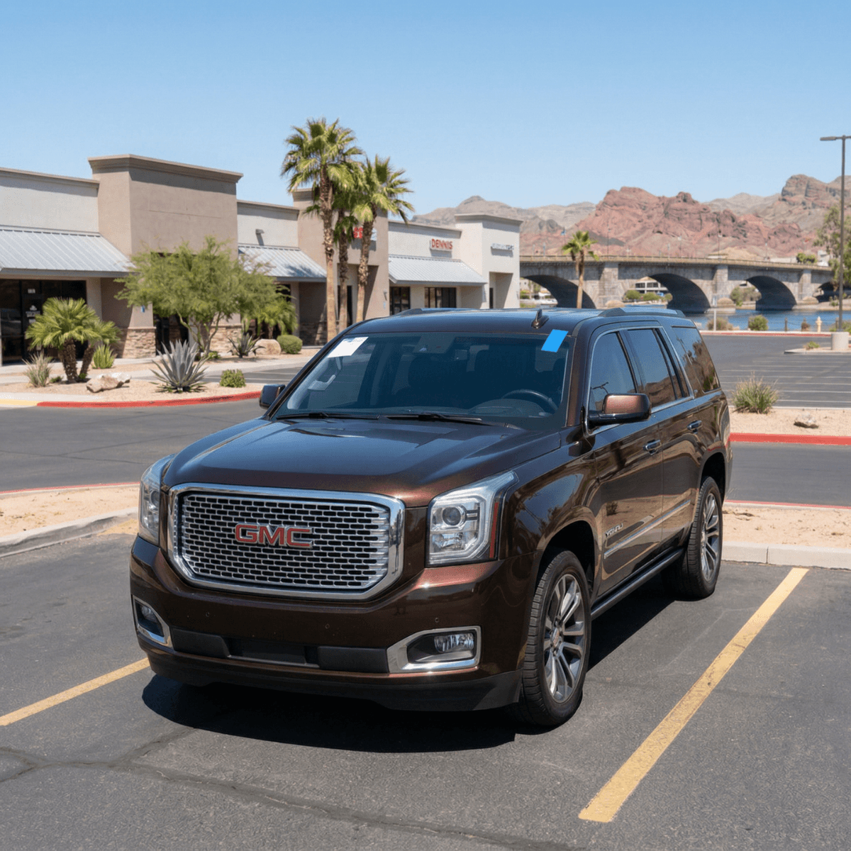 Dark red GMC Yukon with a professionally fitted new windshield at a Lake Havasu City, Arizona parking lot