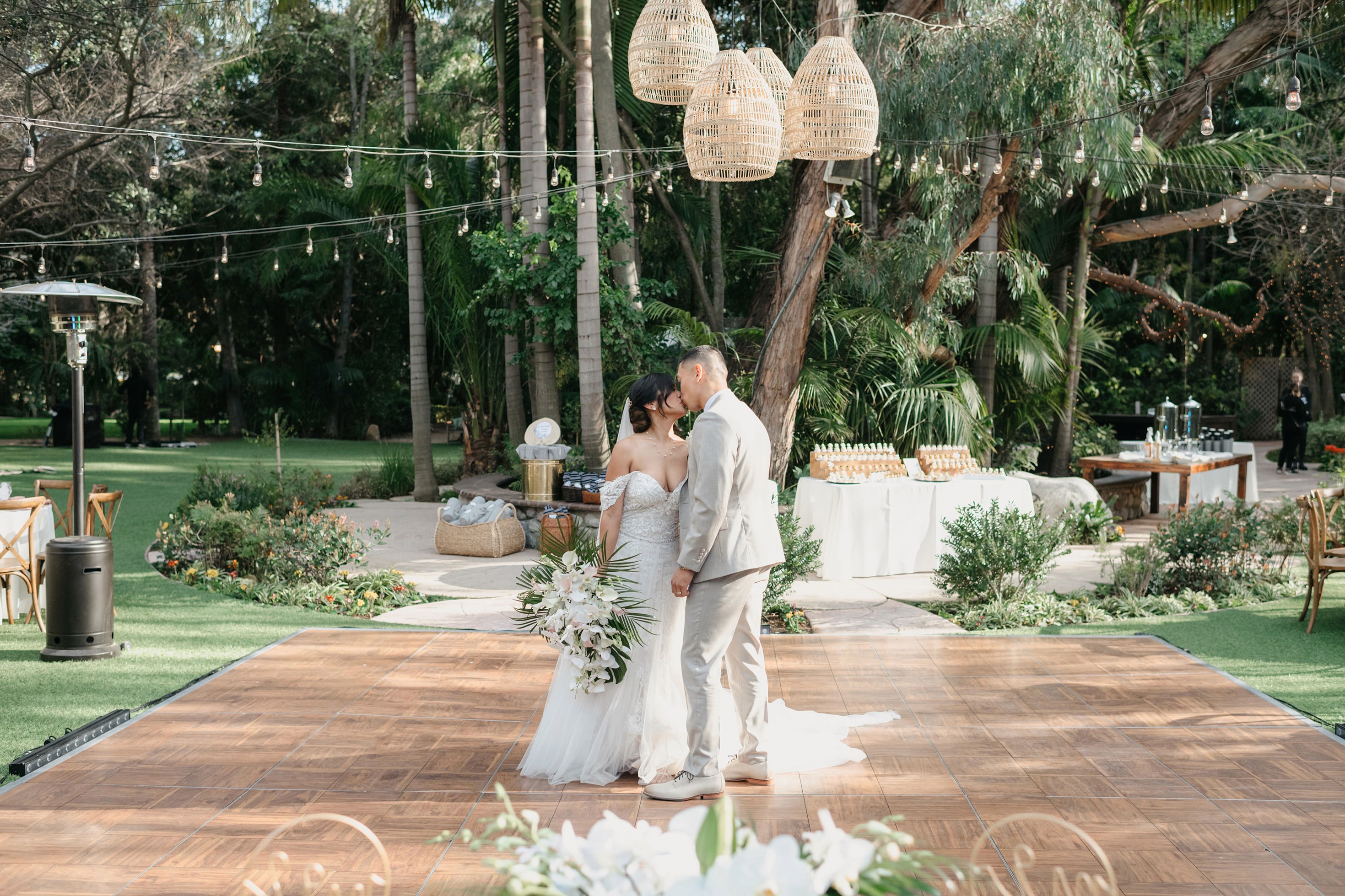 Flat lay wedding details with bouquet, rings, and sparkling bridal heels