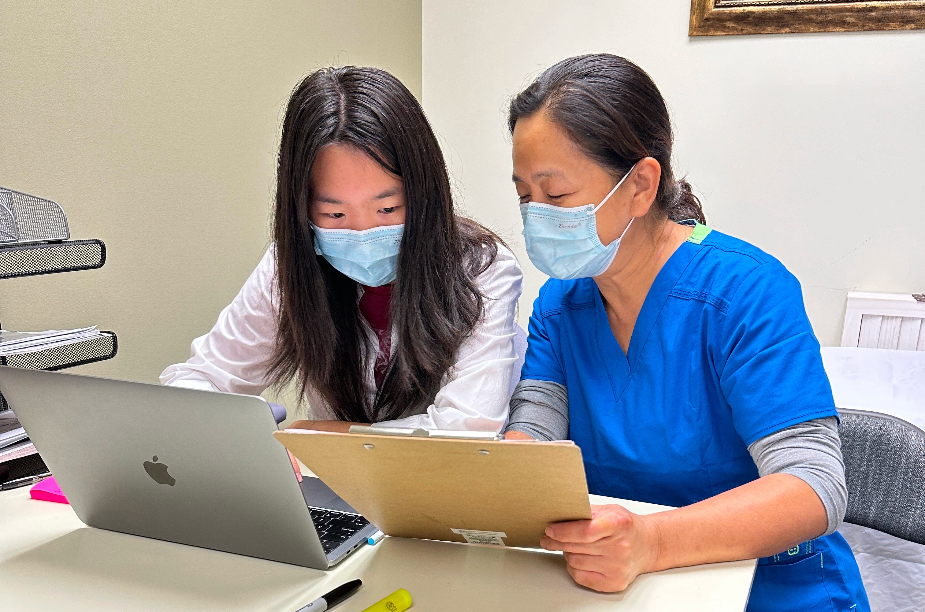 Jolee working at a healthcare office alongside her mother