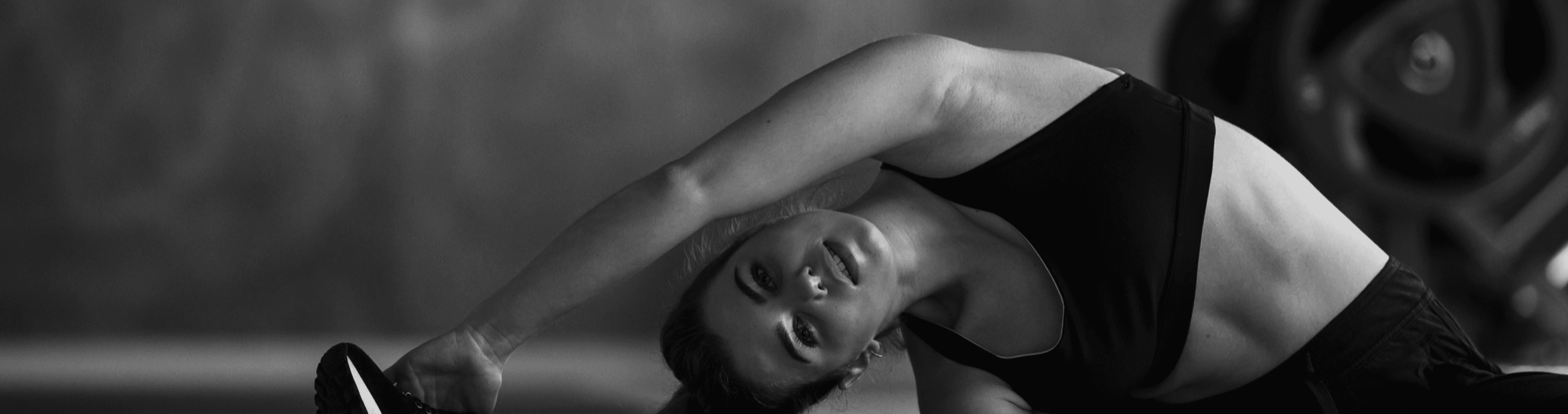 Fit woman performing gentle stretching