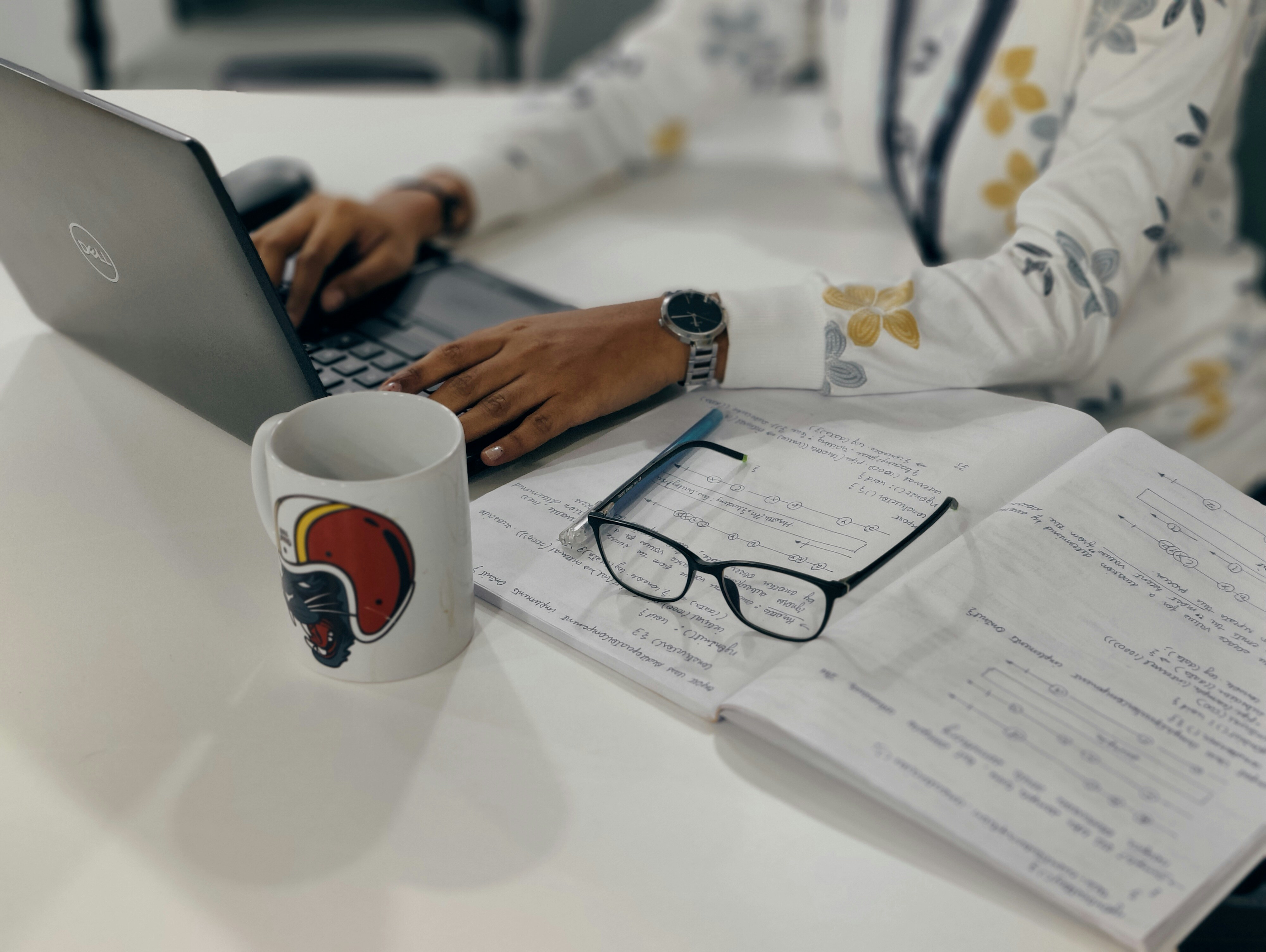 woman with glasses on book - Best AI Tools For Research 