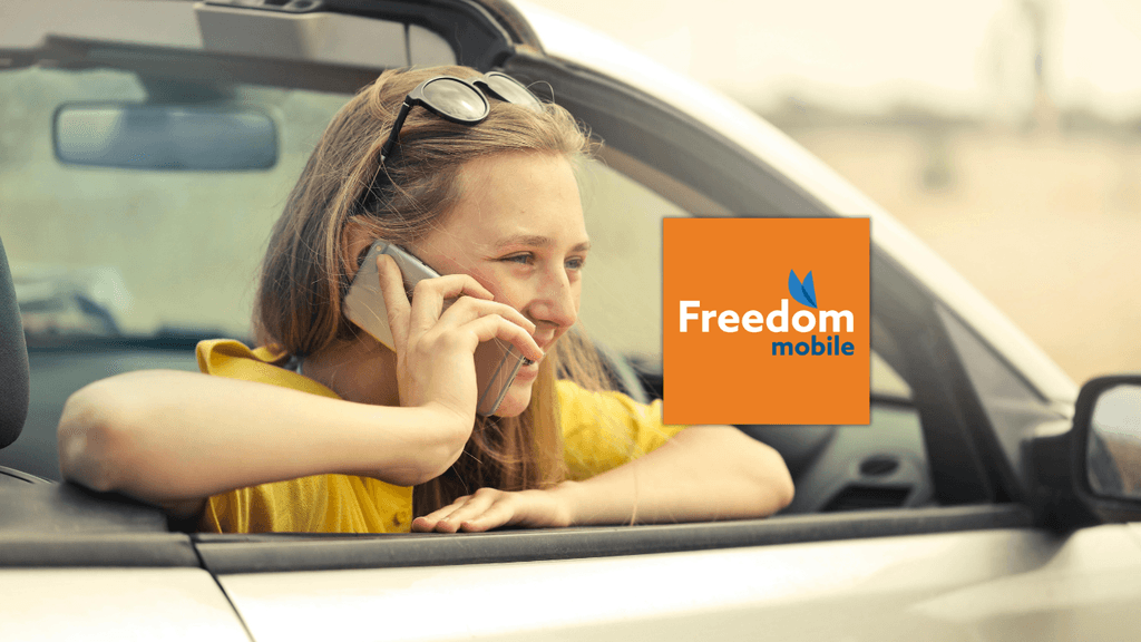 A smiling young woman talking on her smartphone in a car, featuring the Freedom Mobile logo. Represents the $40 Total Freedom 250GB global roaming cell phone plan for newcomers in Canada.