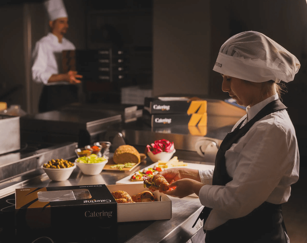 man in white chef uniform cooking