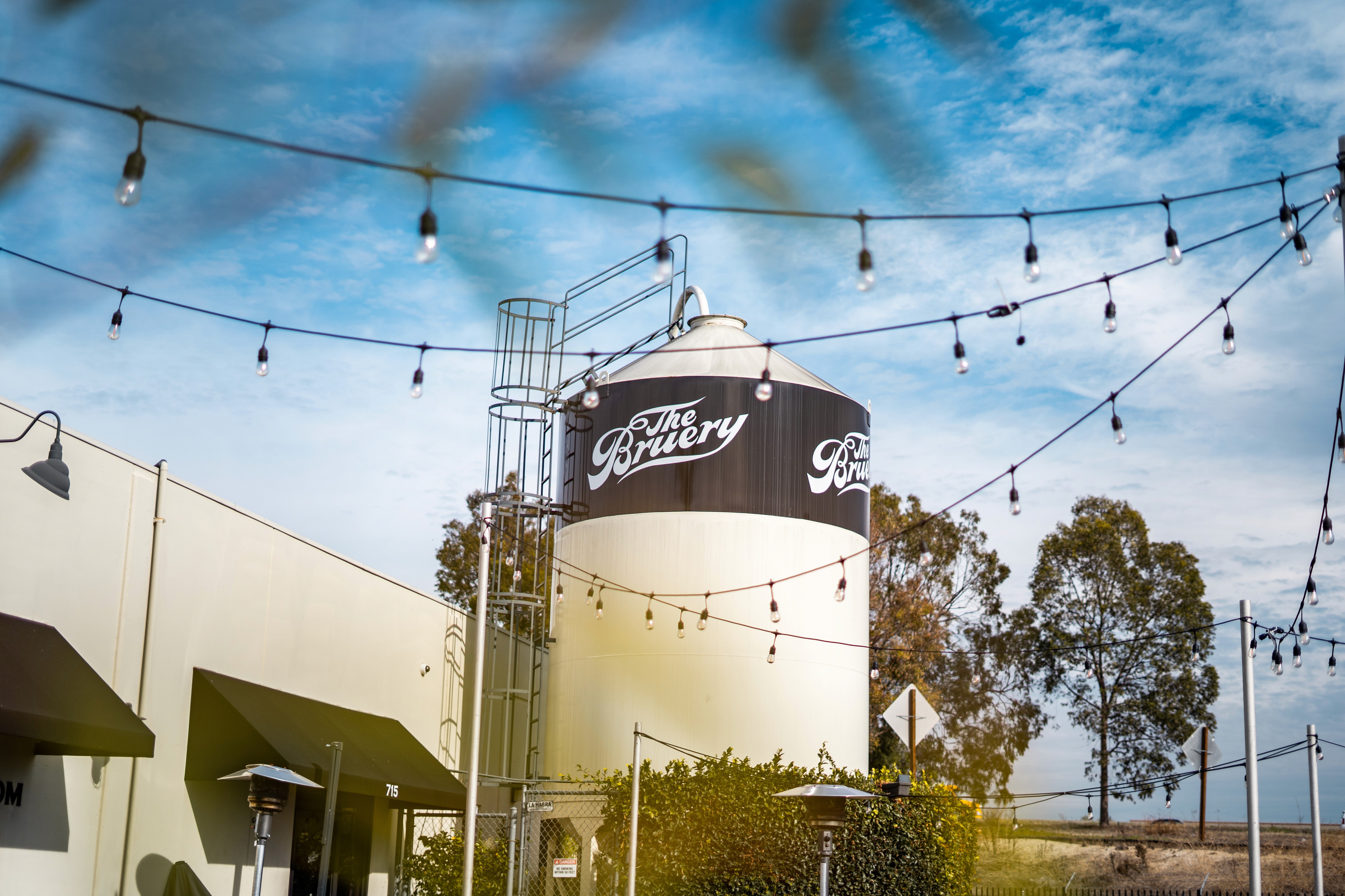 The Bruery brewery building with string lights