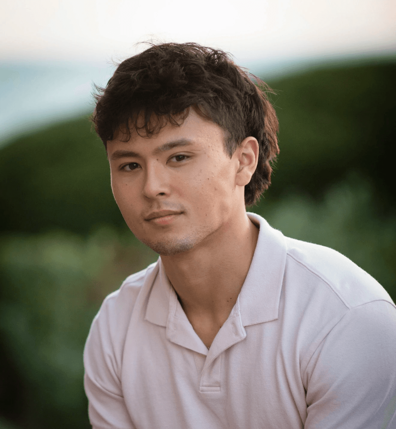 Profile portrait of a man in a grey shirt