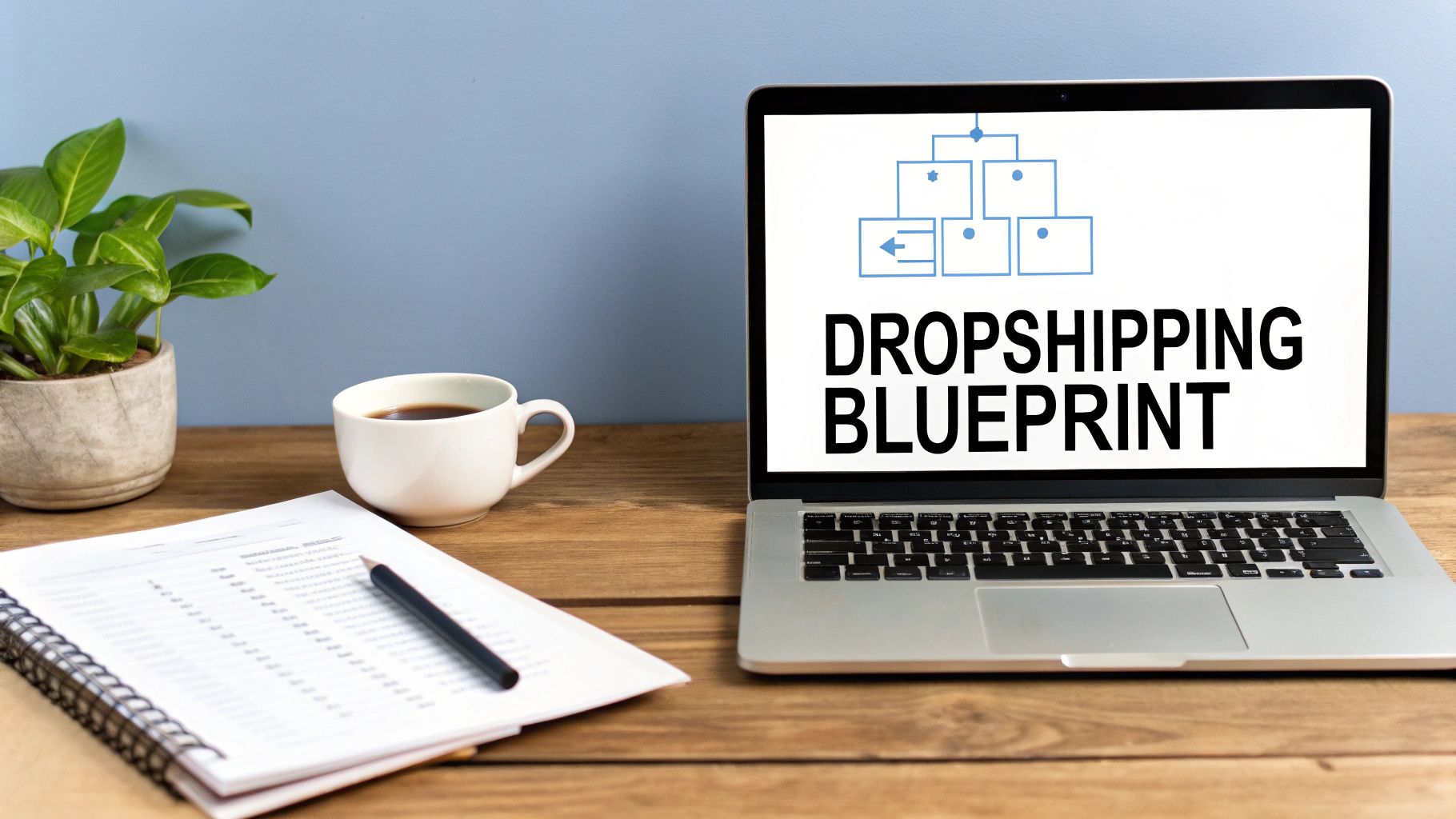 Laptop displaying dropshipping blueprint diagram with notebook, coffee, and plant on wooden desk