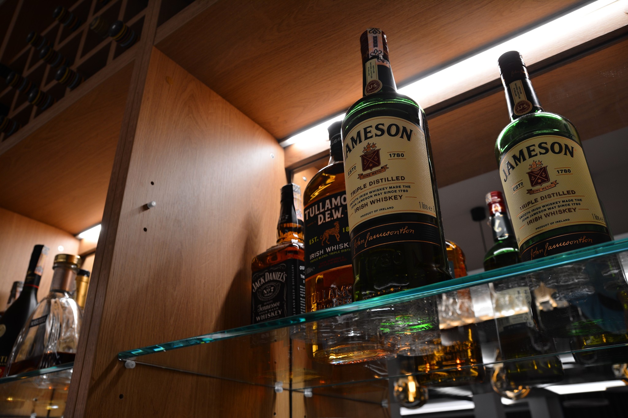 a group of people sitting around a bar