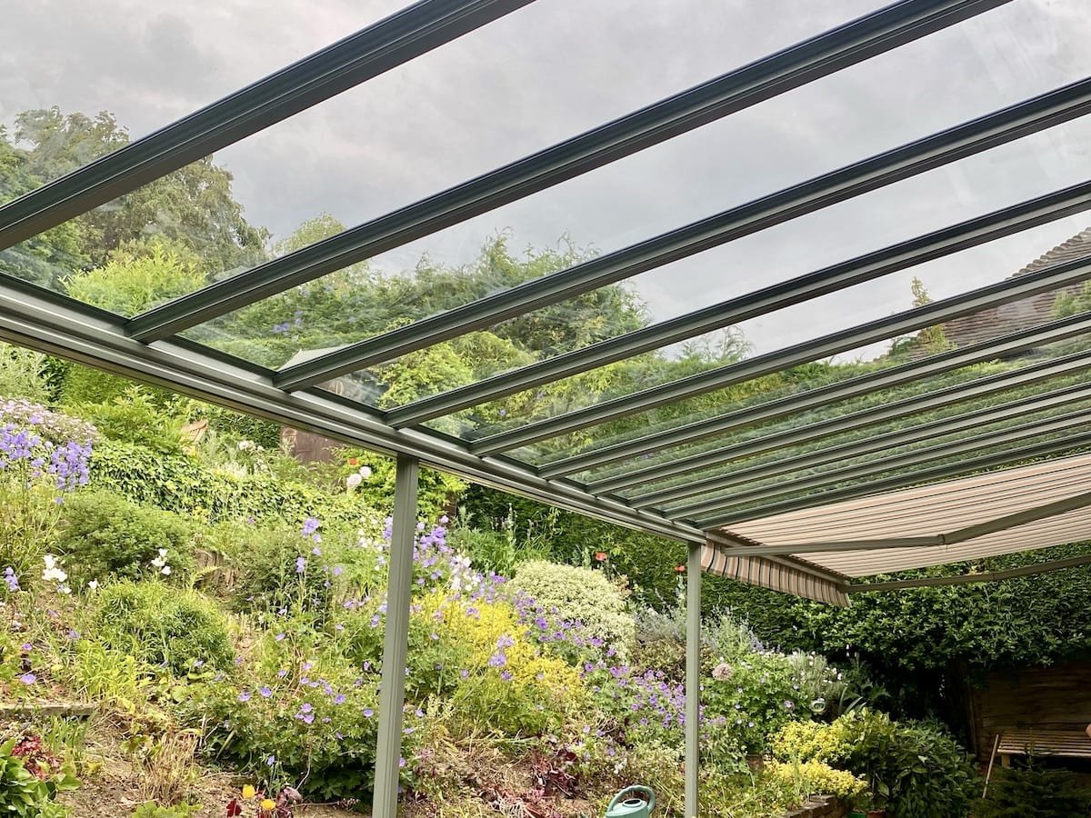 An aluminium veranda with a glass roof, built and fitted by GXG Aluminium