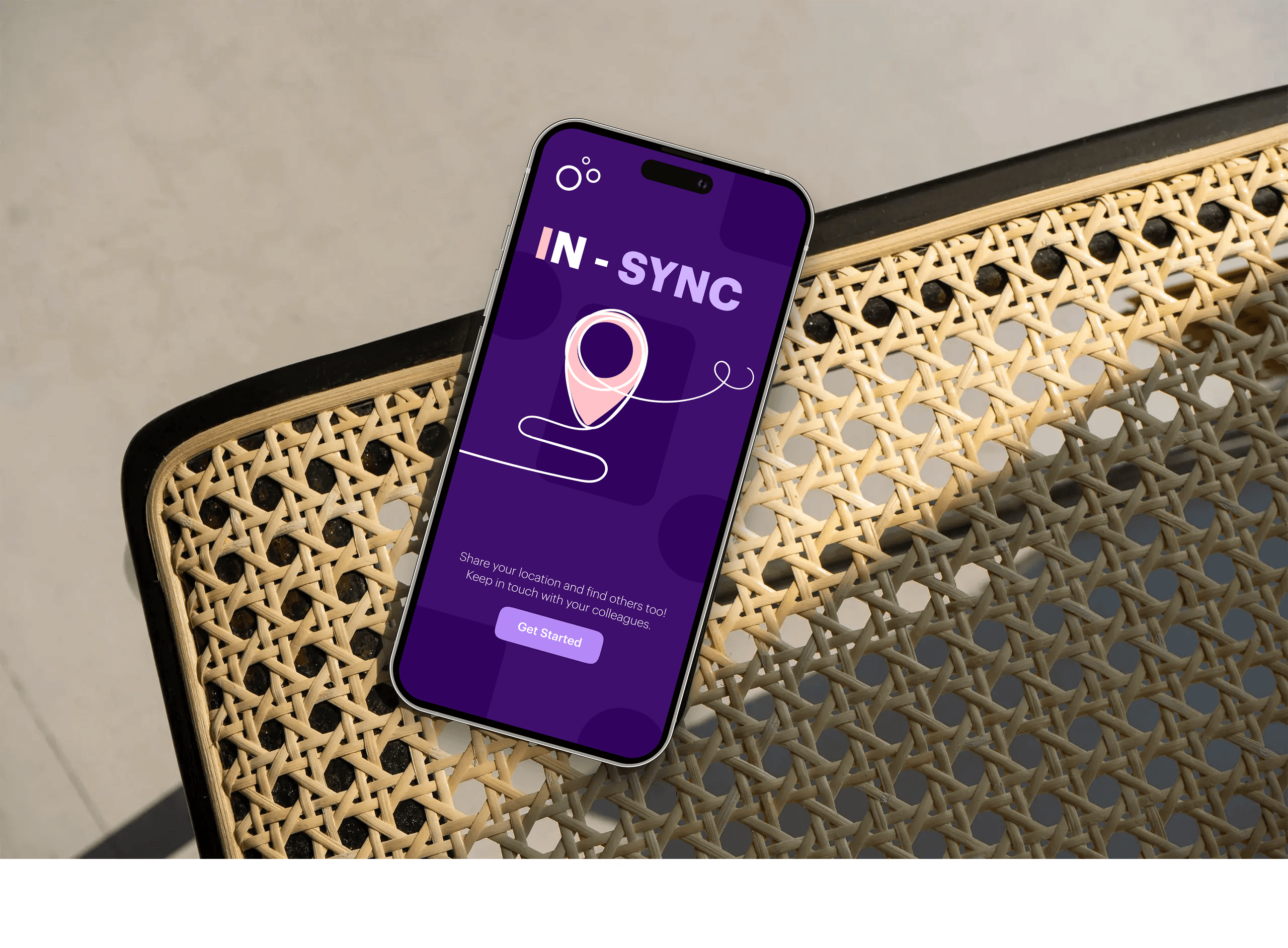 A mockup of an iPhone placed on a chair's back