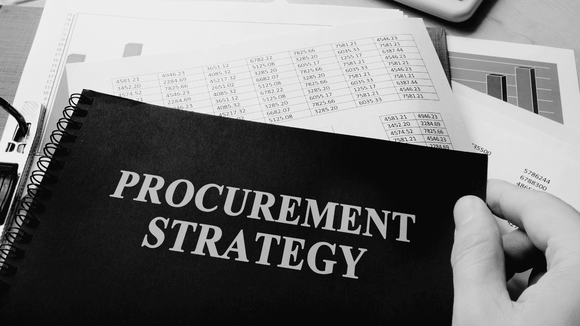 Person sitting in a modern office in front of a wall covered with notes and sketches.