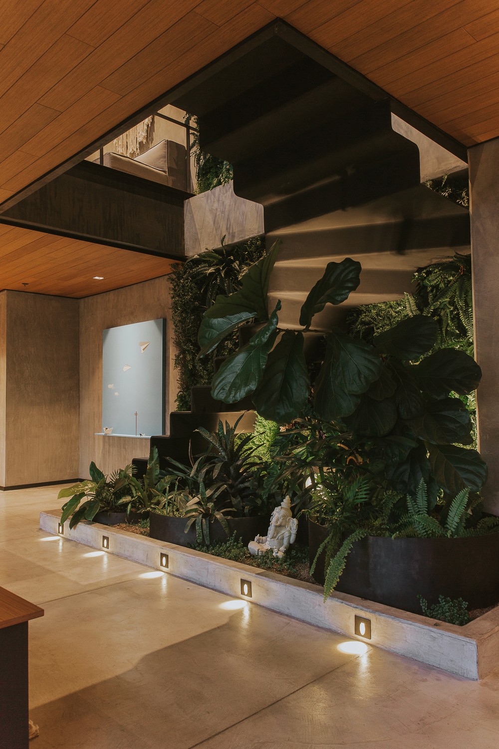 Double-height interior with flowing sculptural forms and warm raking light