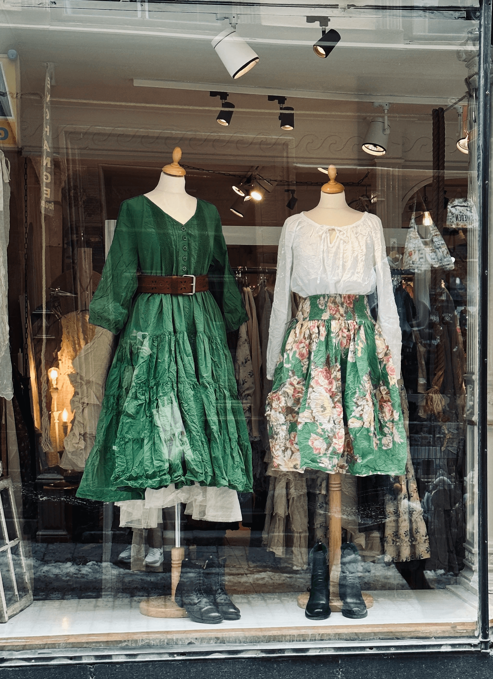 Two people talking on a rooftop at sunset