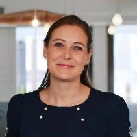 smiling woman holding cheek