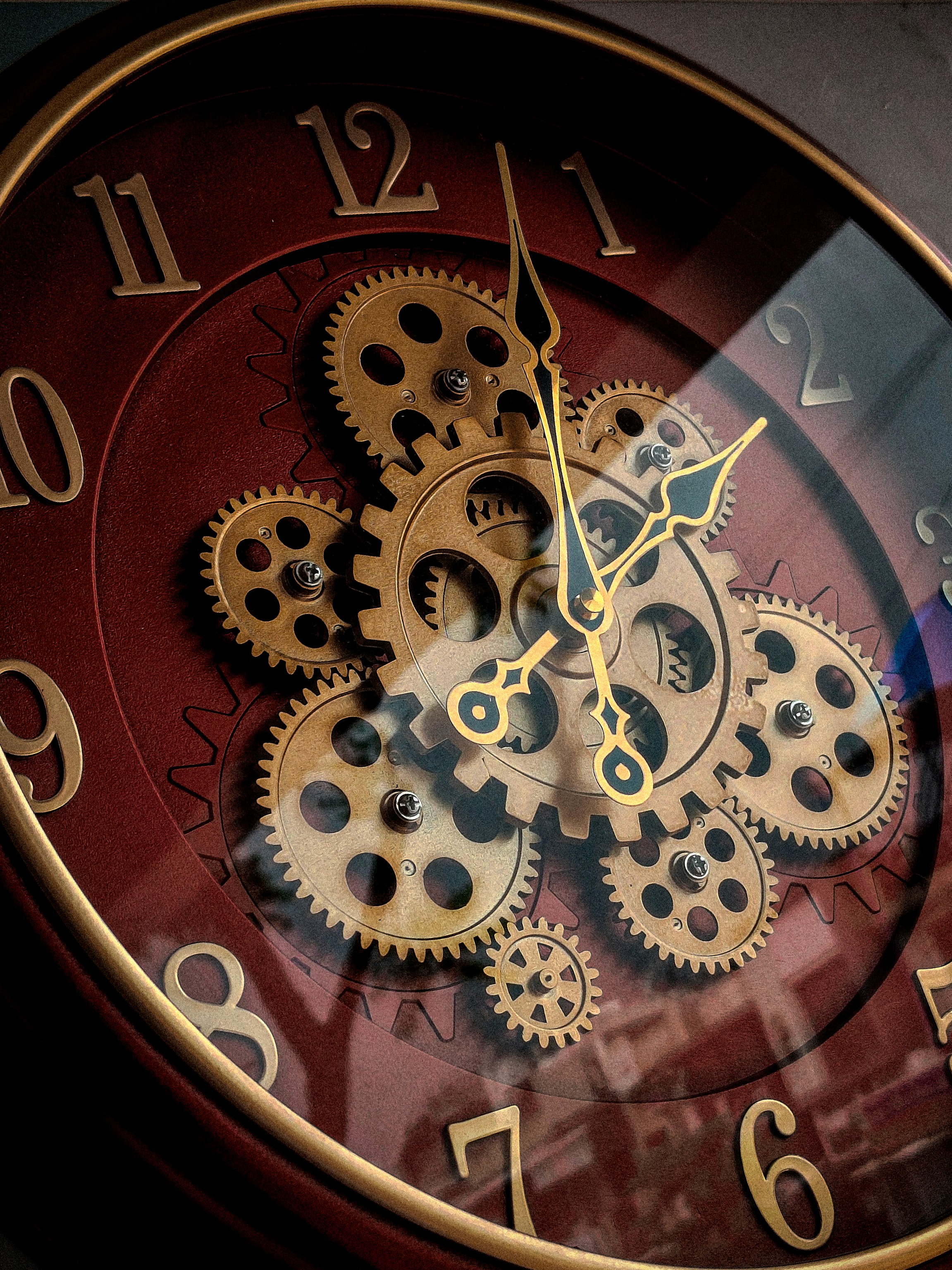 Creative product photography of a vintage-style wall clock with gears, detailed capture by Samuel Singh Bhakuni.