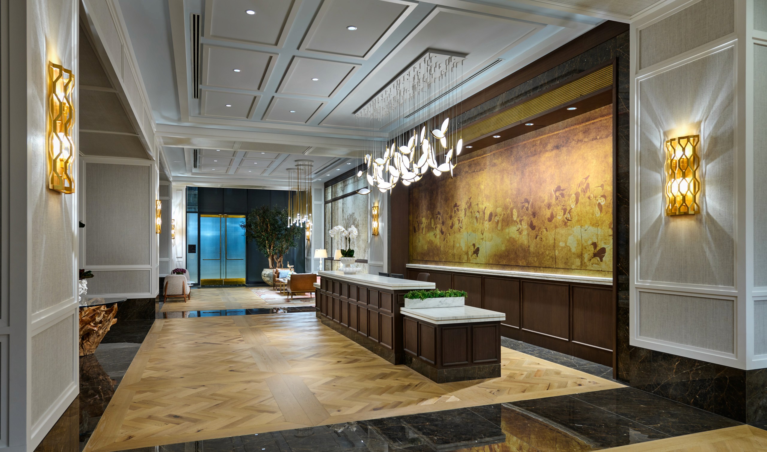 Lobby with parquet floor and accent lighting