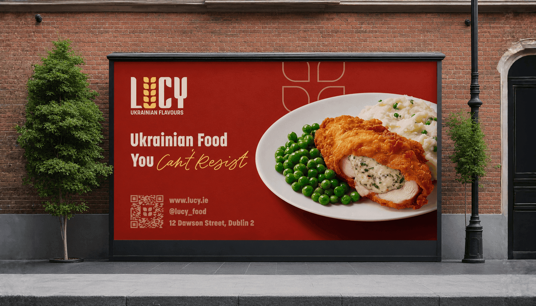 Street billboard reading 'Ukrainian Food You Can't Resist' with a photo of stuffed chicken, peas, and mashed potato