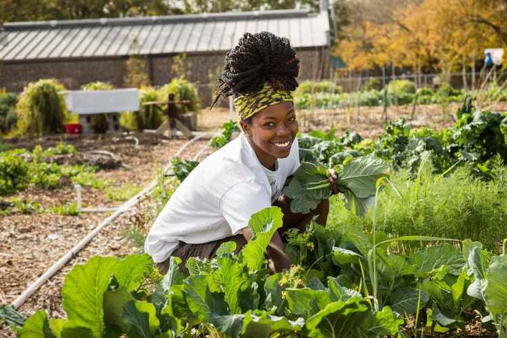 Local female farmer with fresh vegetables