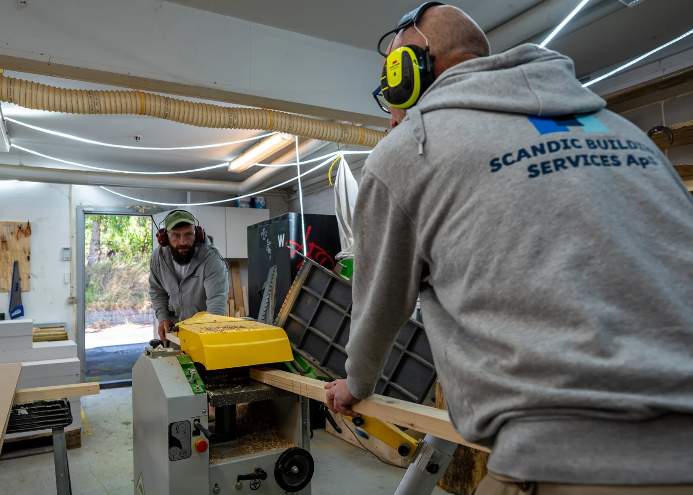 Craftsmen working with wood for a decking project