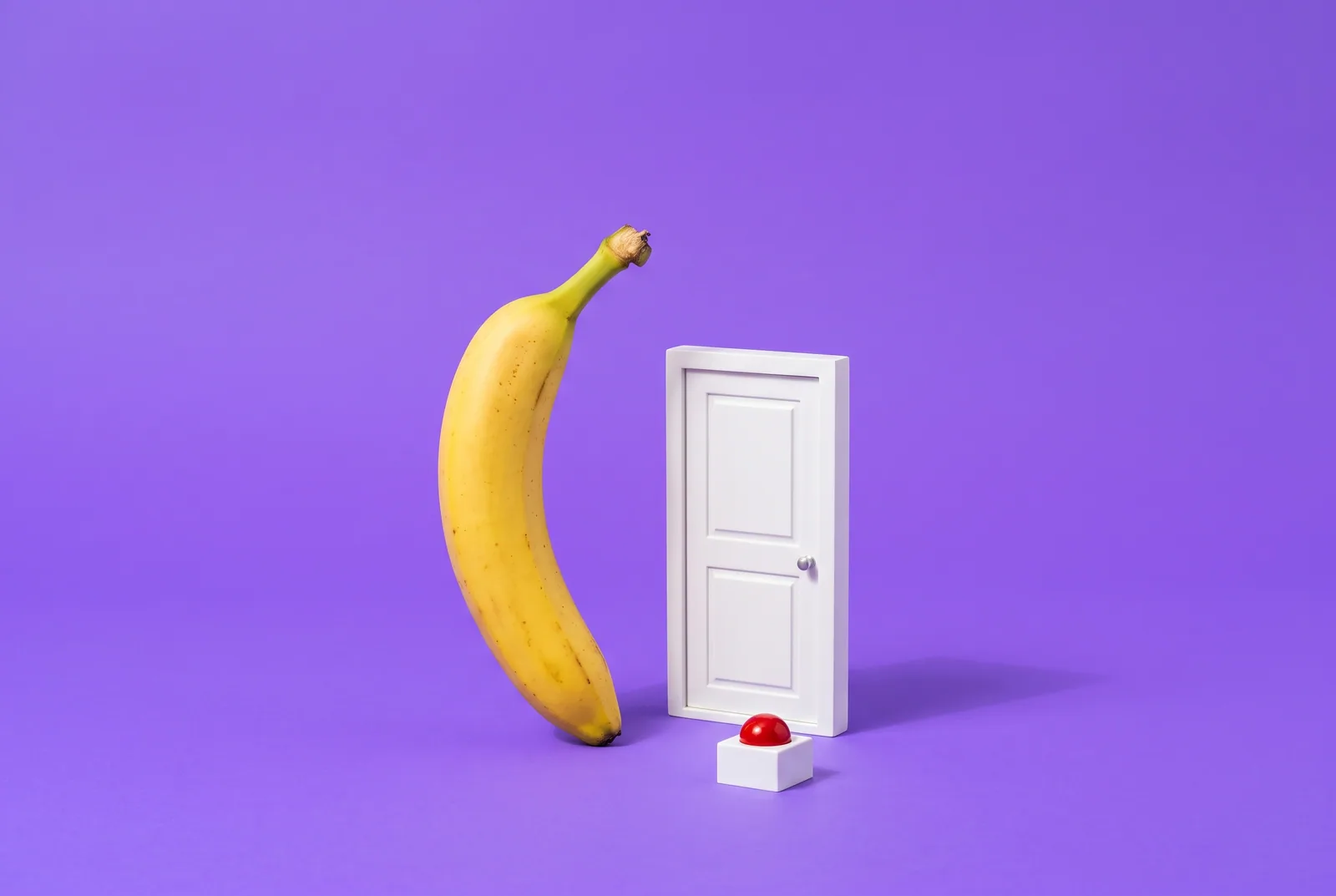 A banana beside a closed door and a red emergency button, why a craving tool matters in QUITTR vs BlockerX