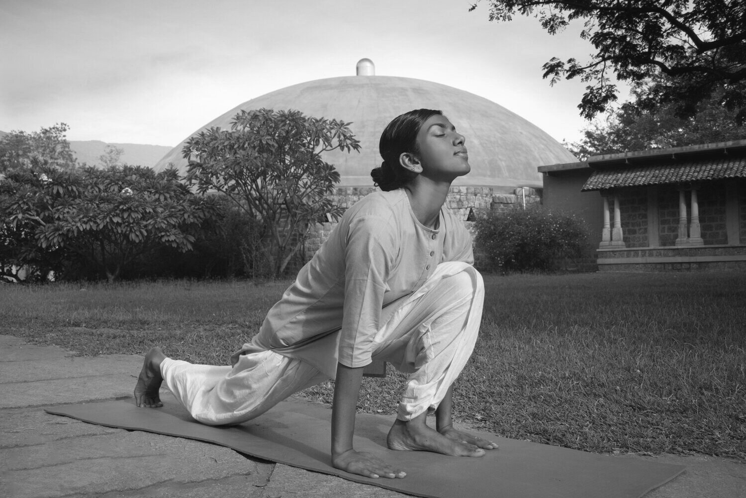 Fashion photoshoot with a woman posing in a dress