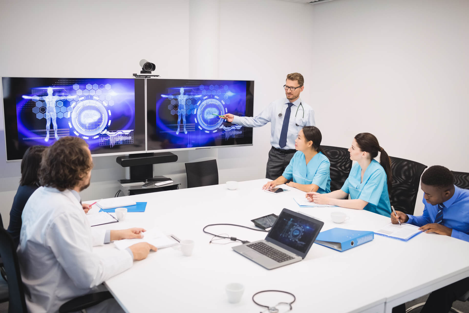 people sitting on chair in front of laptop computers