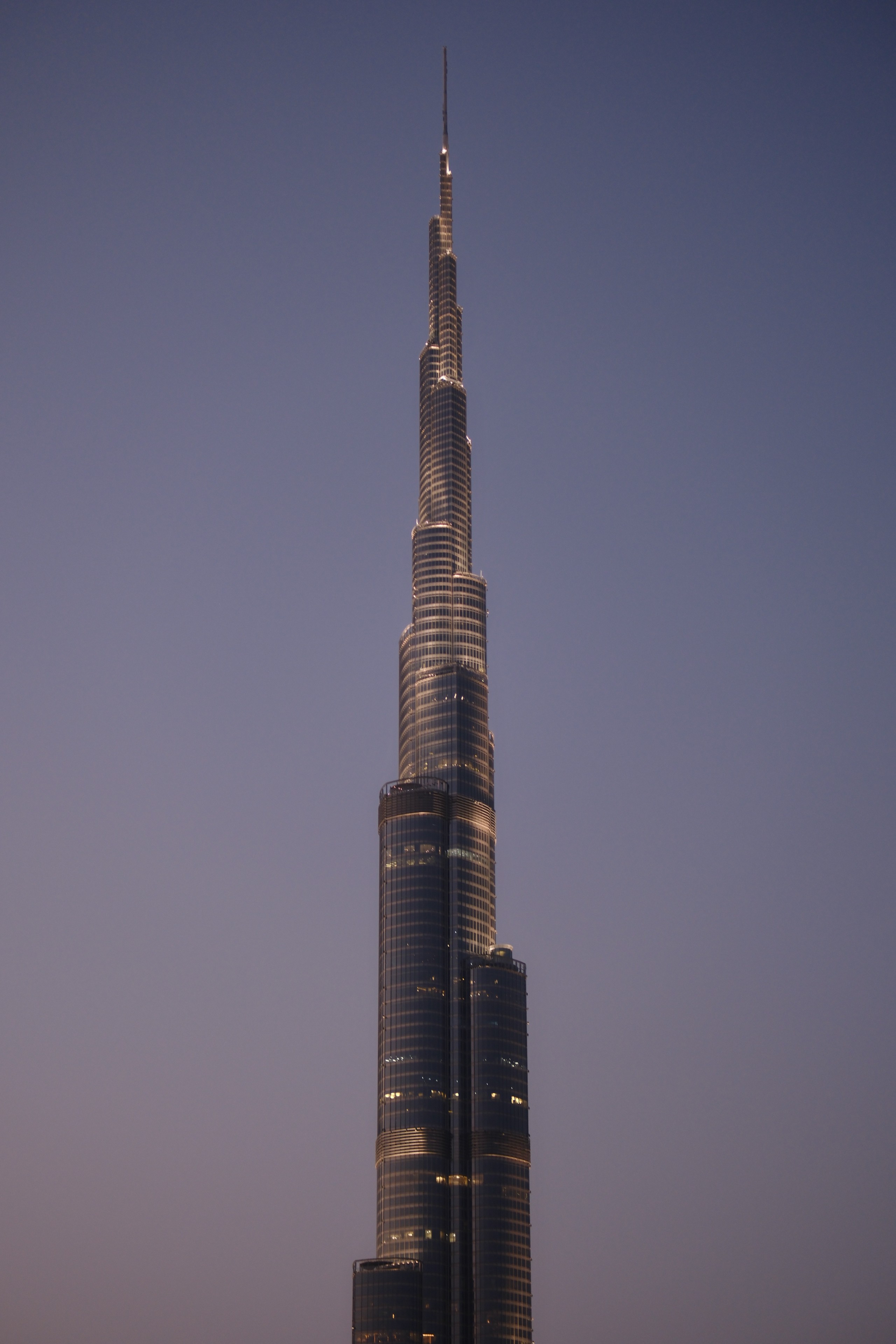Athlette woman on orange background.
