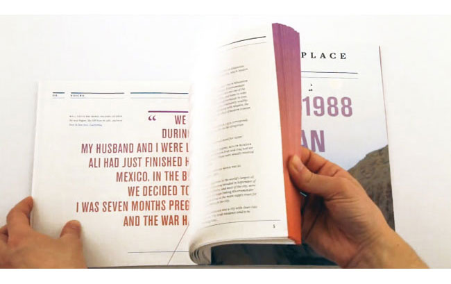 Two hands hold open a book displaying text on the left page. The text reads: “MY HUSBAND AND I WERE ALI HAD JUST FINISHED IN MEXICO. IN THE BIG WAR WE DECIDED TO BE SEVEN MONTHS PREGNANT AND THE WAR HAD BEGUN.” On the right page, the text continues: “PLACE 1988.” A portion of a photograph is visible on the right page.
