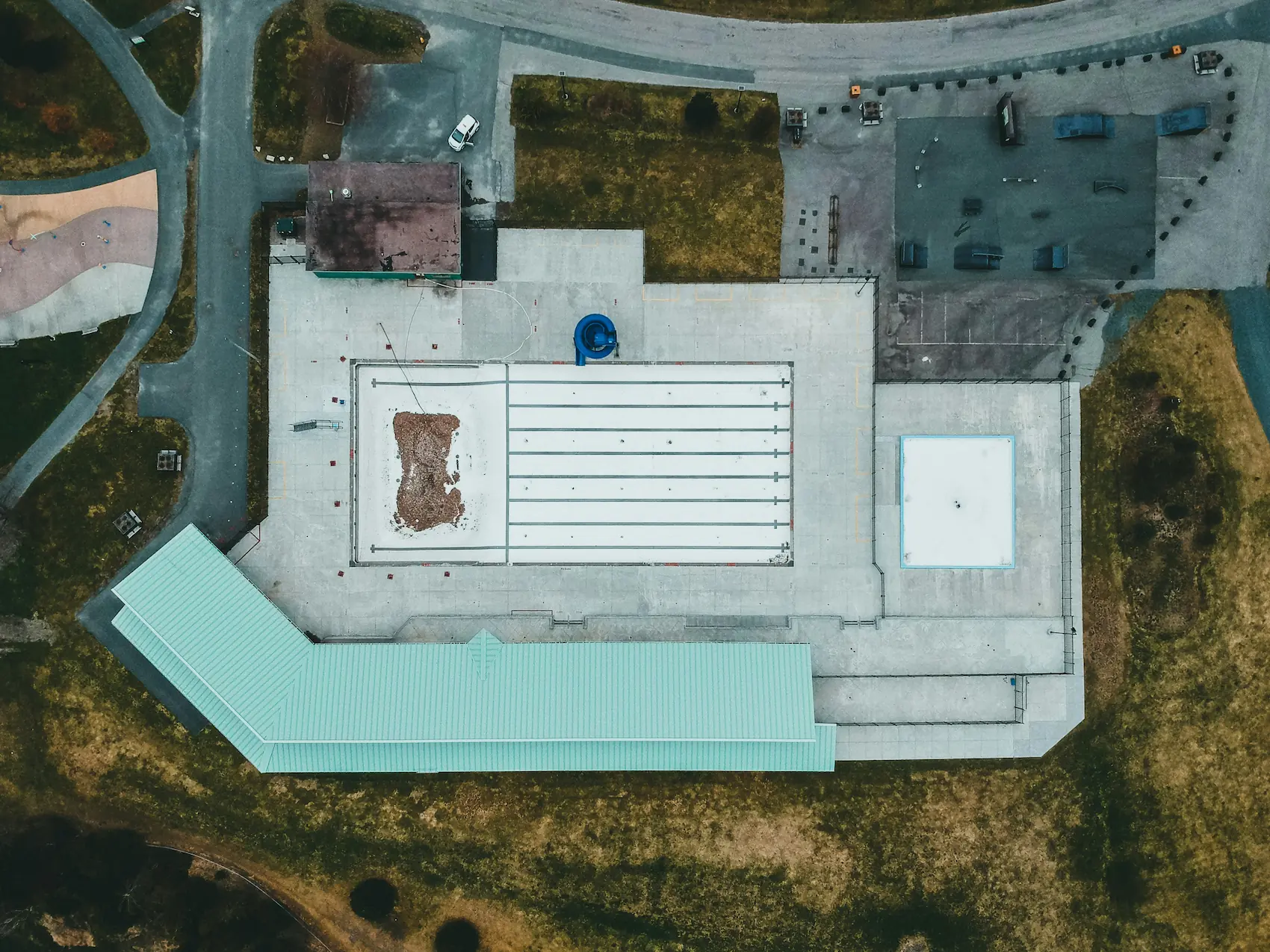 Top-down drone photography of a recreational facility and swimming pool, captured for a detailed site survey