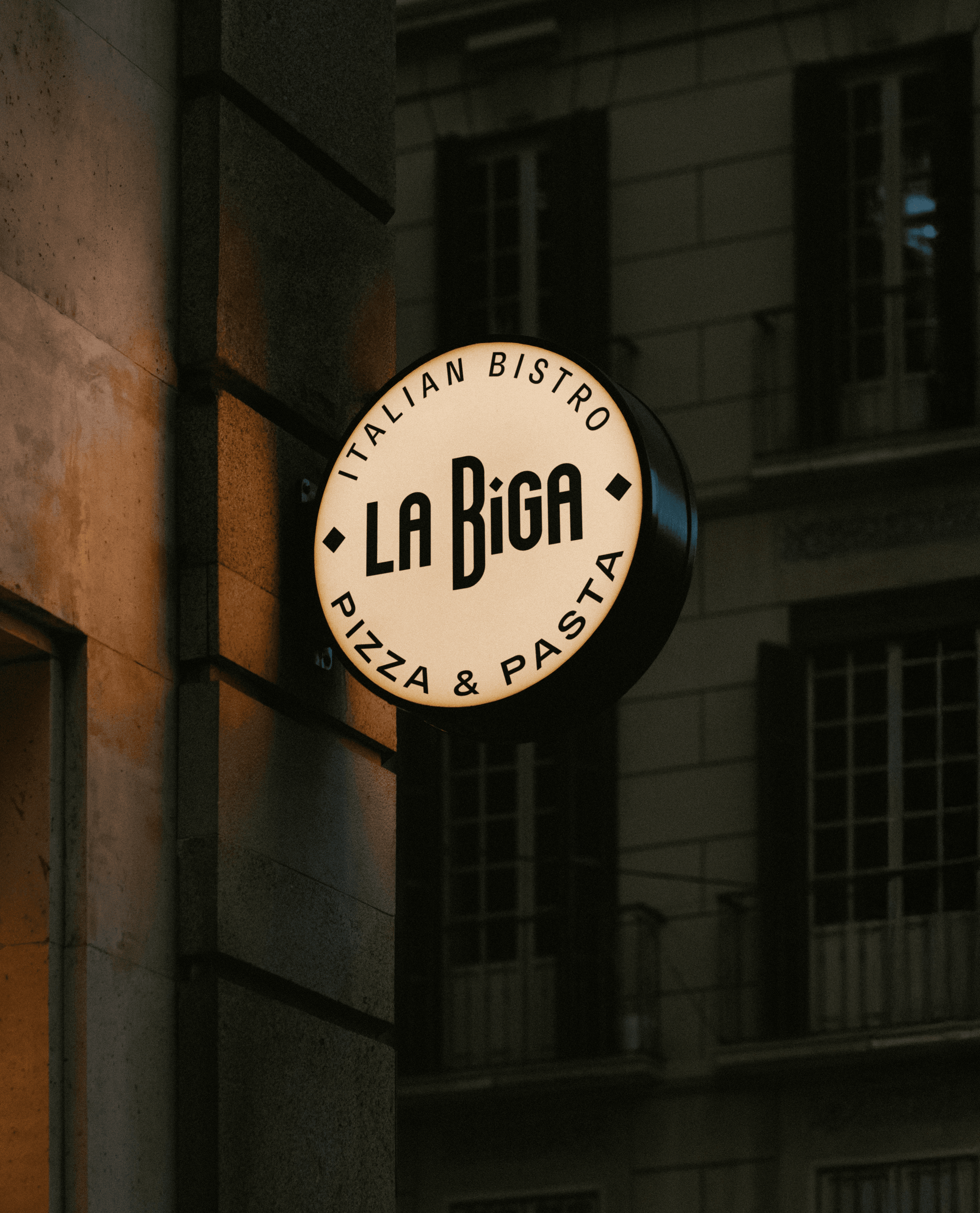 Streetside billboard with flyposters of the Batch.Works brand and illustrations