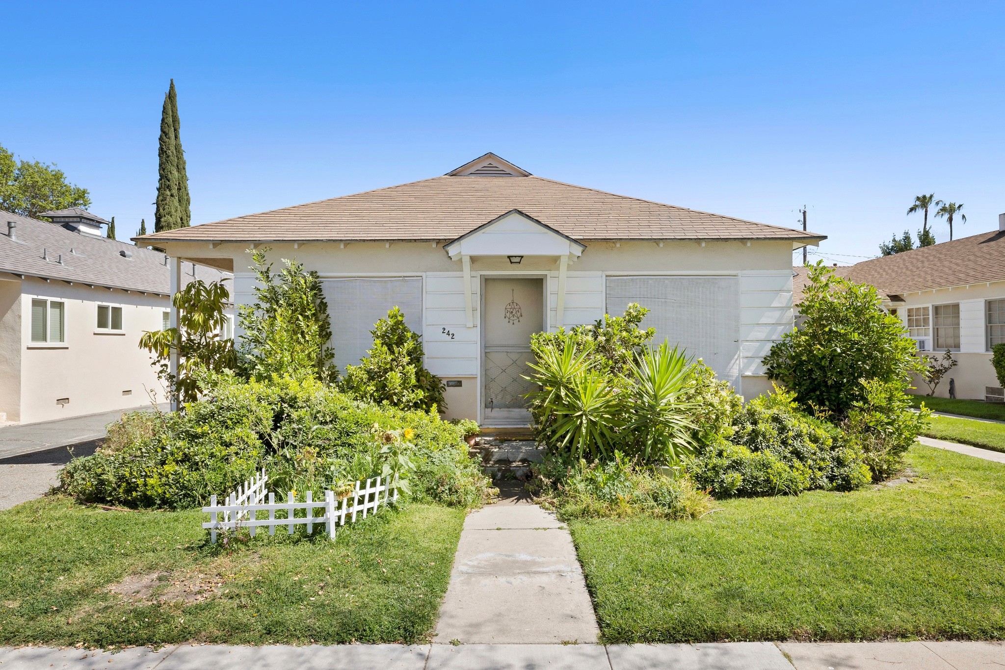 Front view of duplex with landscaped yard and walkway at 242 N Cordova in Burbank neighborhood.