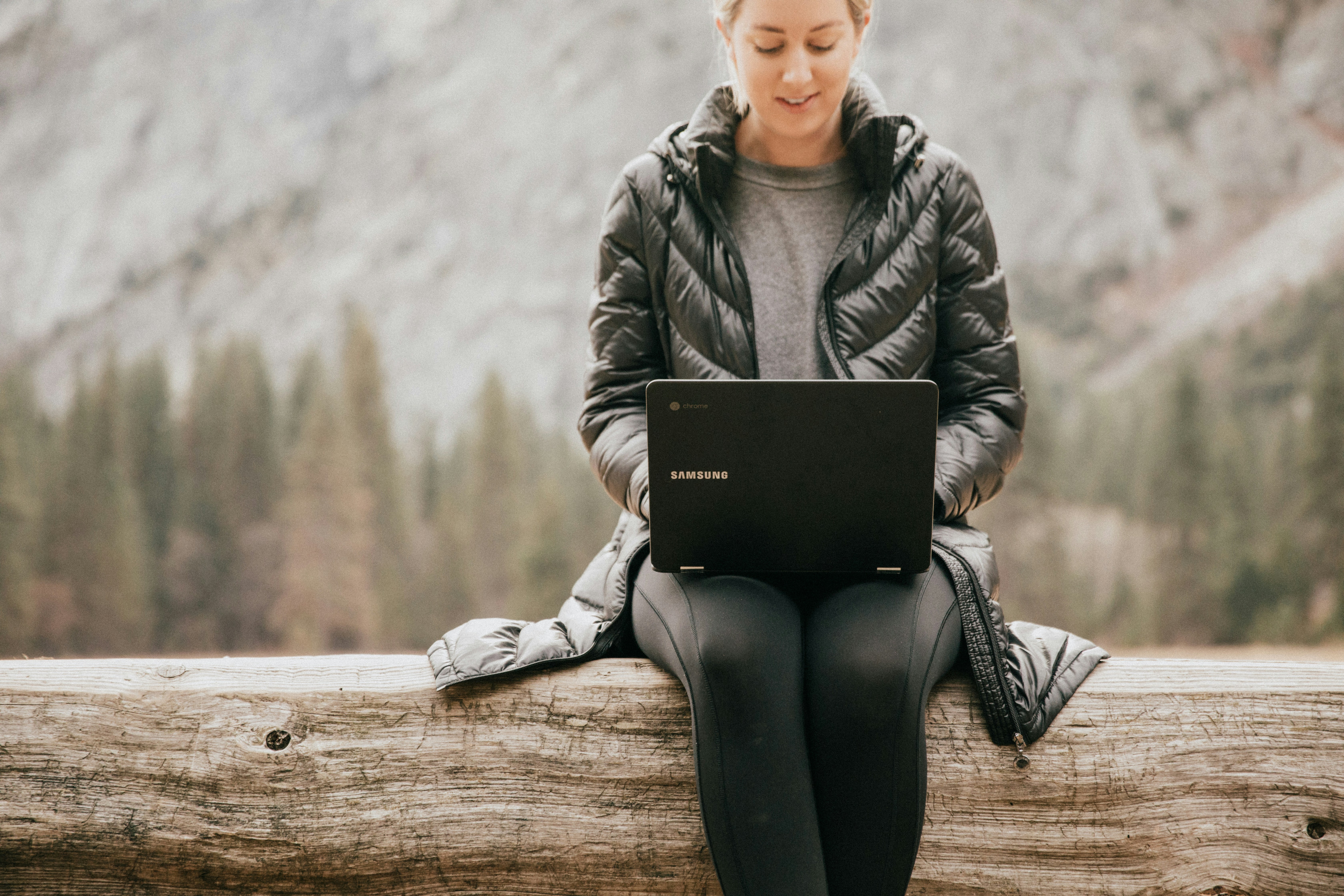 woman sitting alone on a wood - AI Tools for Time Management