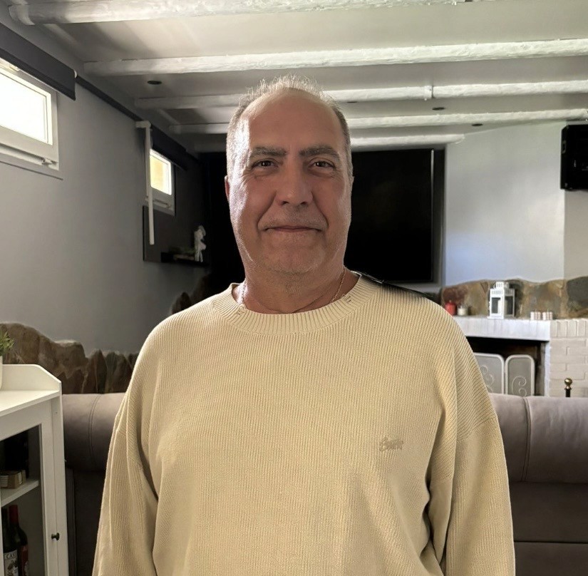 A happy customer smiling wearing orange headband