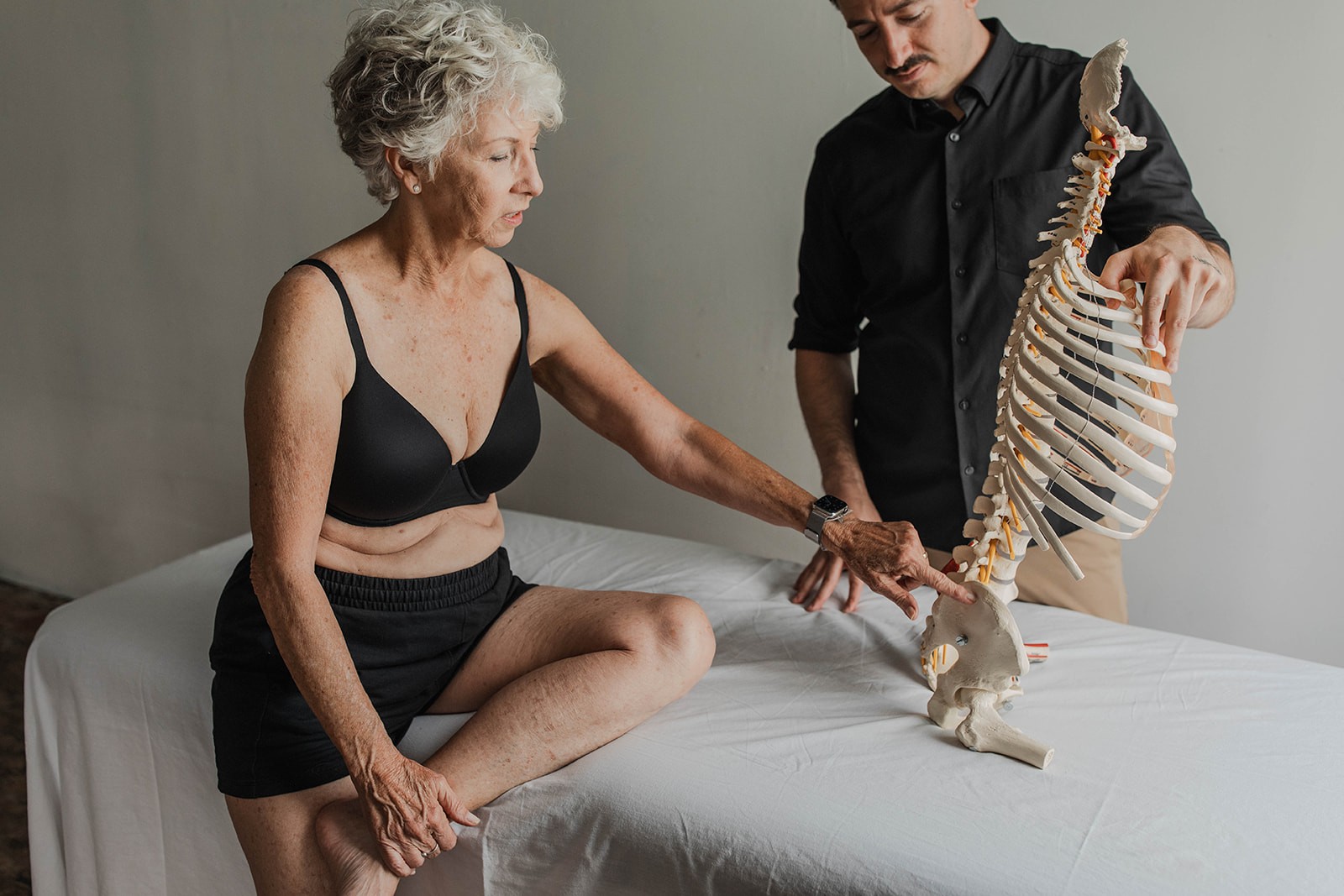 Client with back pain receiving Rolfing from Ryan in Sacramento.