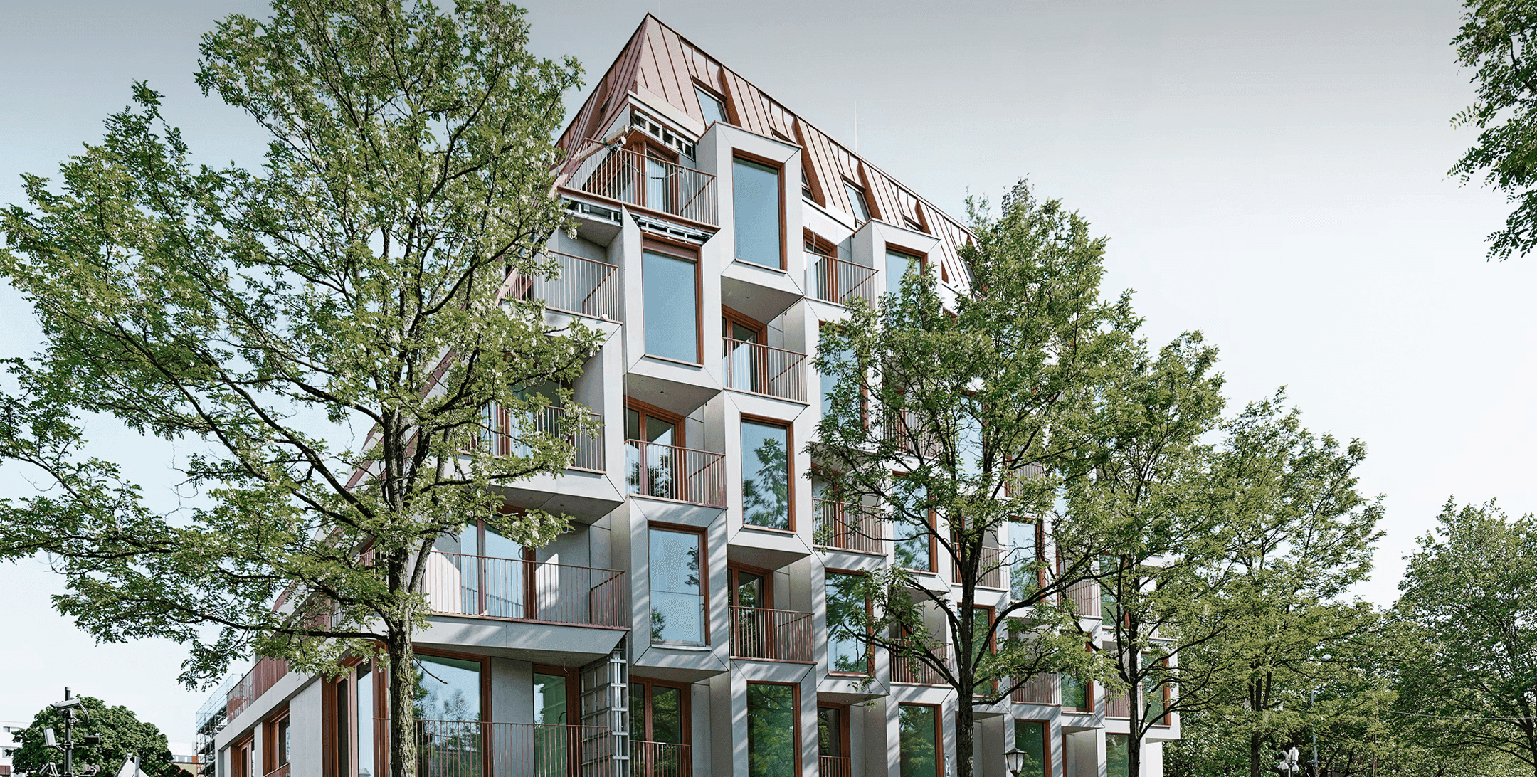 Sustainable GFRC concrete facade panels large format building exterior by Rieder
