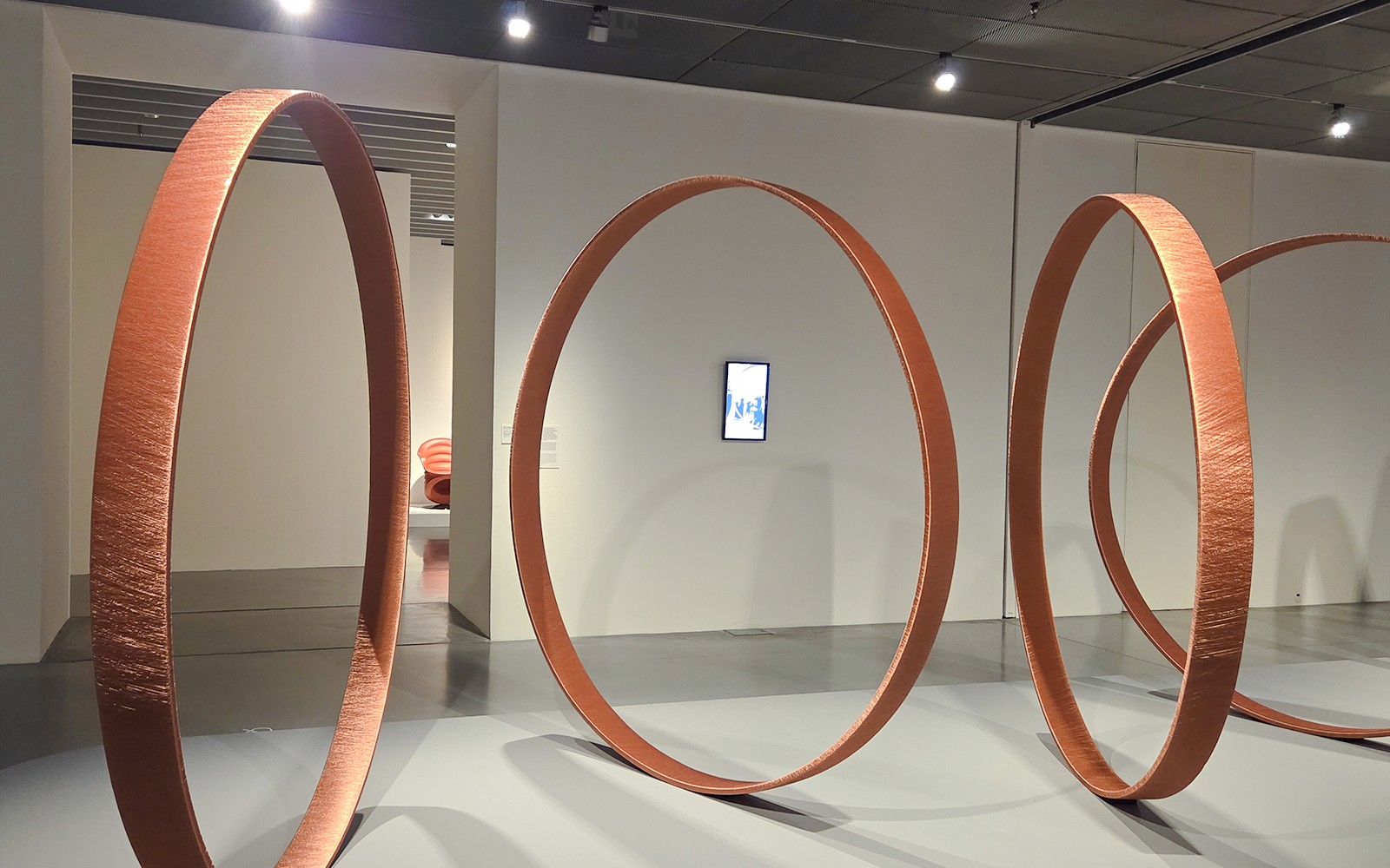 Large circular sculptures in Centre Pompidou Malaga exhibition interior.