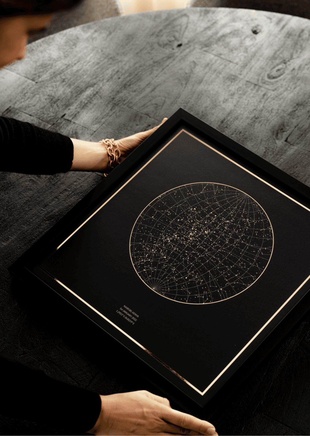 A Black Night Sky Star Map with Gold Foil details.