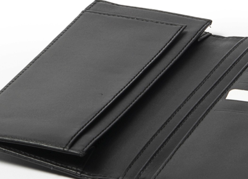 Detail view of the wallet's interior showing a large vertical slip pocket on the left side.