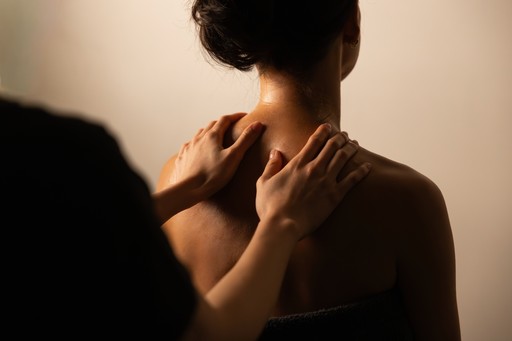 a woman holding onto a man's arm