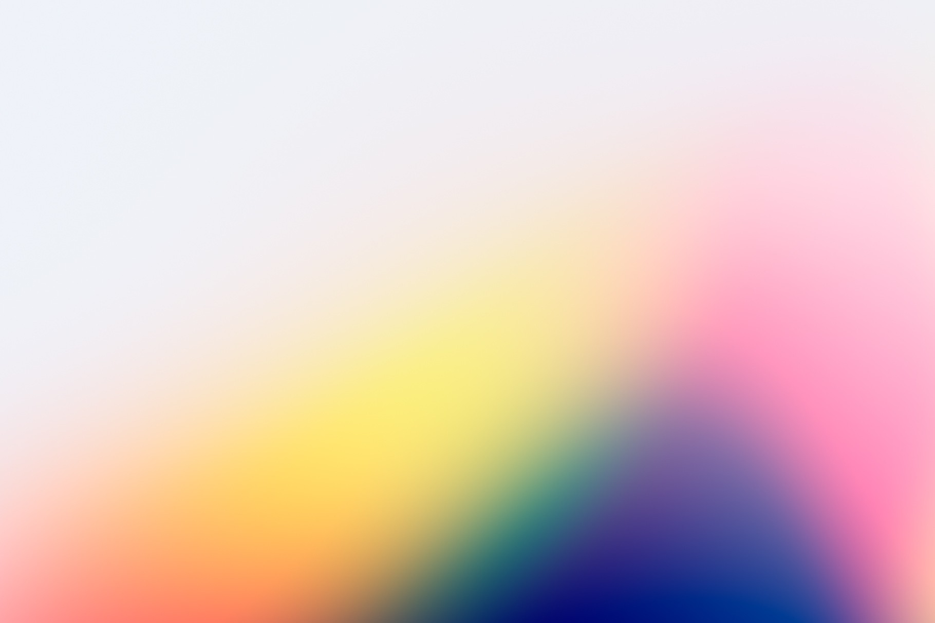 Light gradient wallpaper with warm tones of yellow, pink, and deep blue blending together.