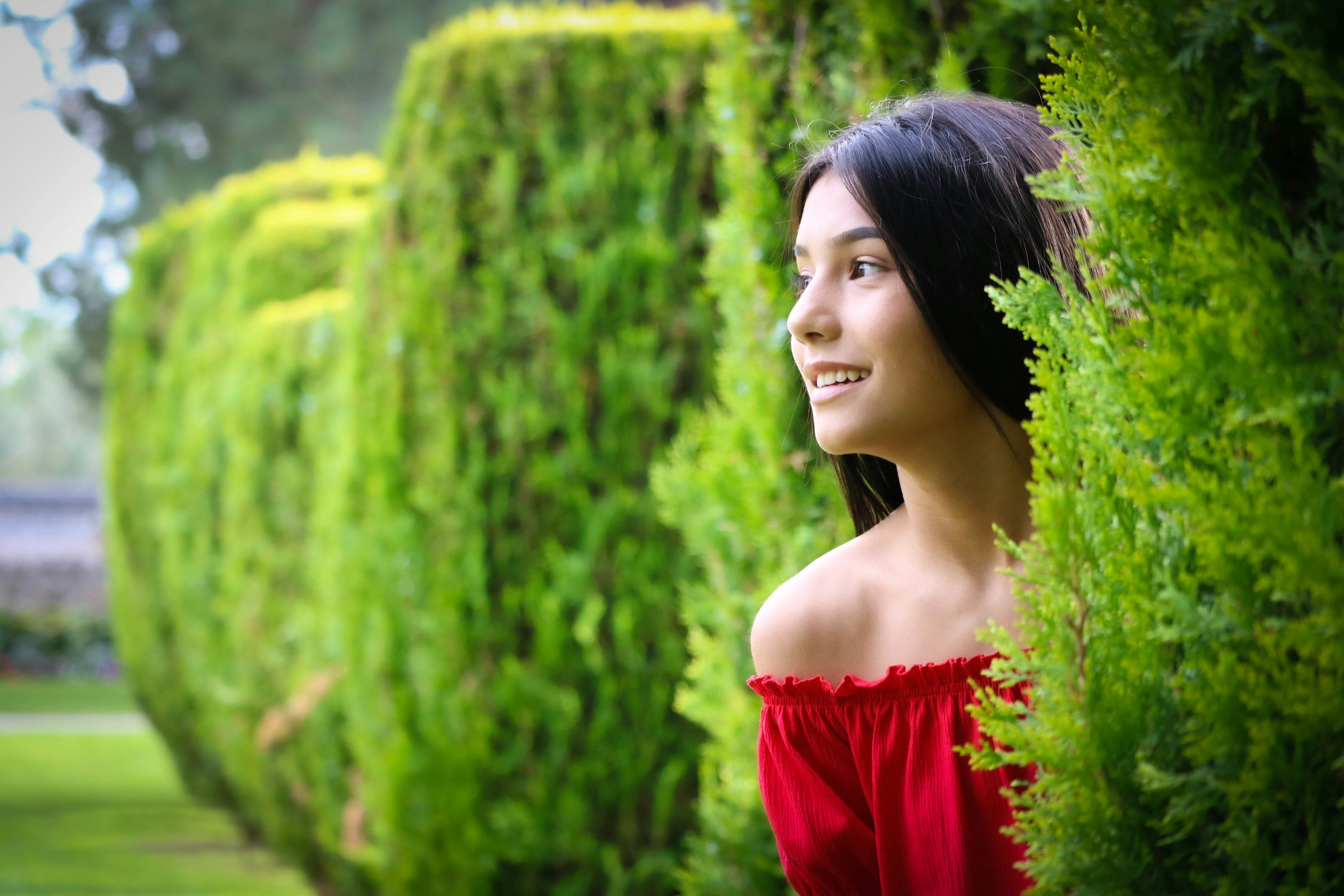 woman in red off shoulder dress