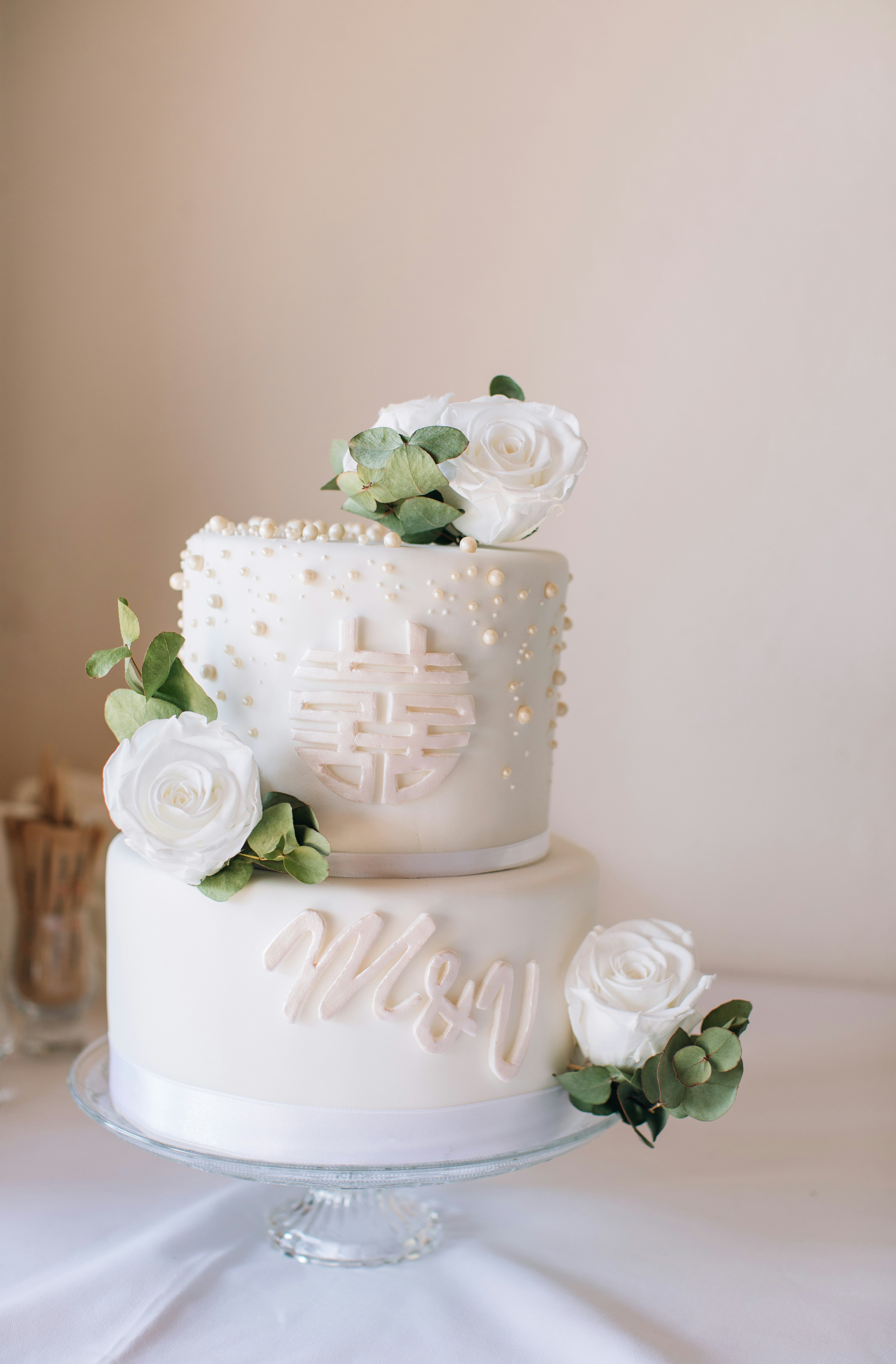 2 tier wedding white cake with live roses