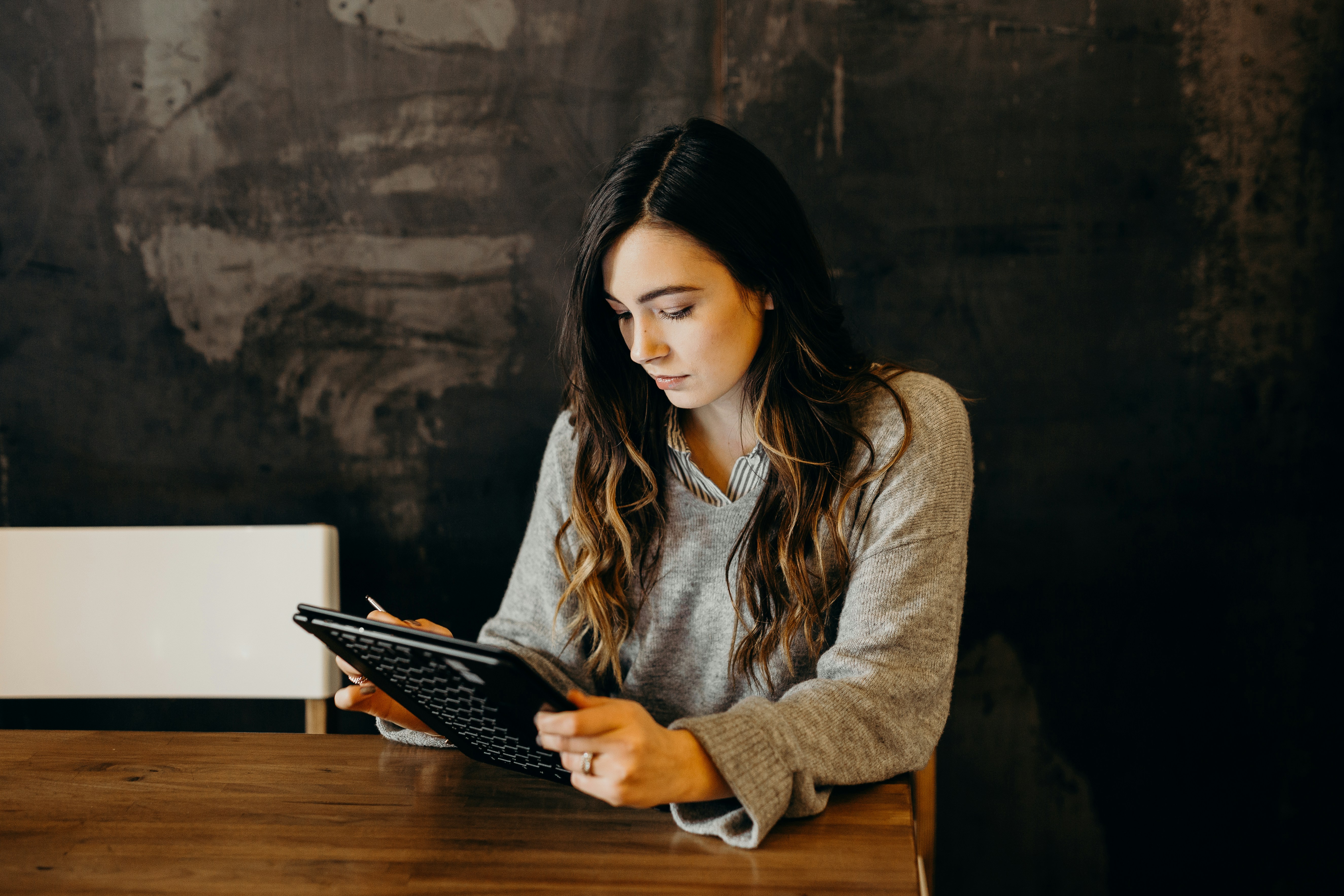 A woman using a tablet.