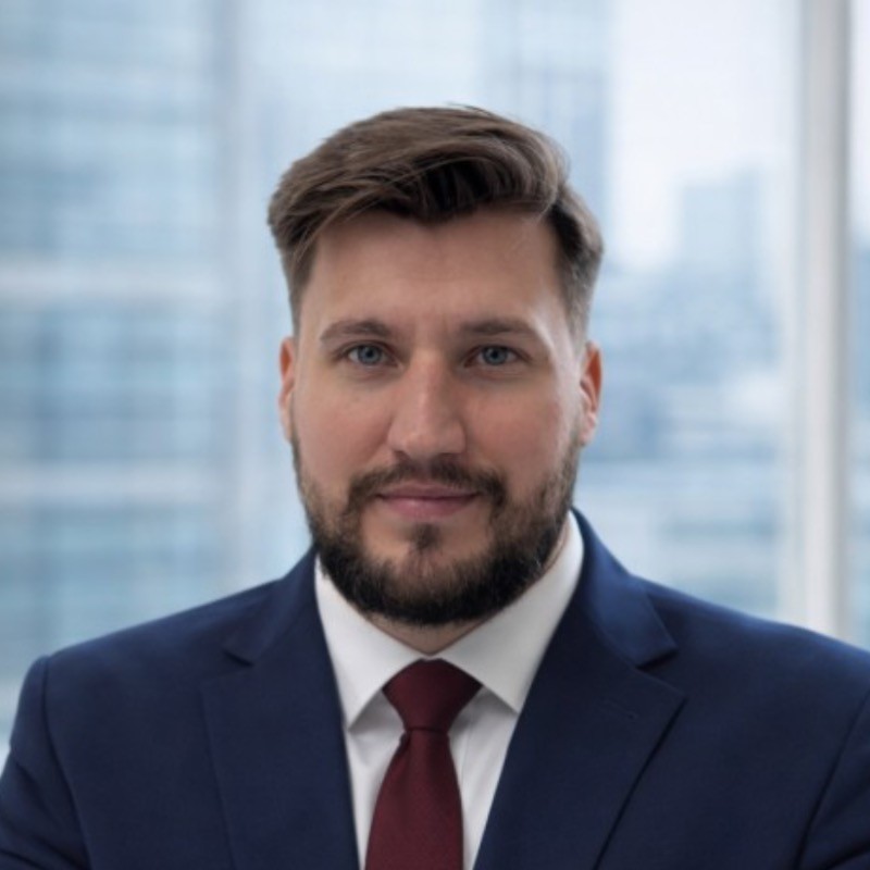 a man in a blue suit posing for a picture