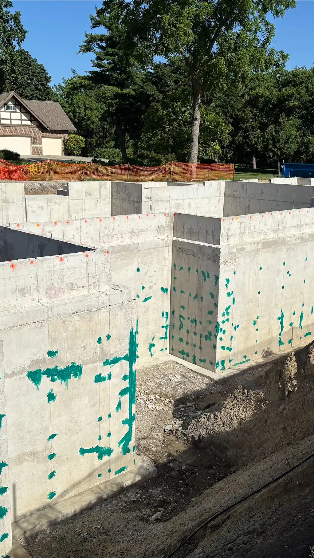 A foundation that has been pre-treated with Rub-R-Patch waterproofing putty as a crack filler