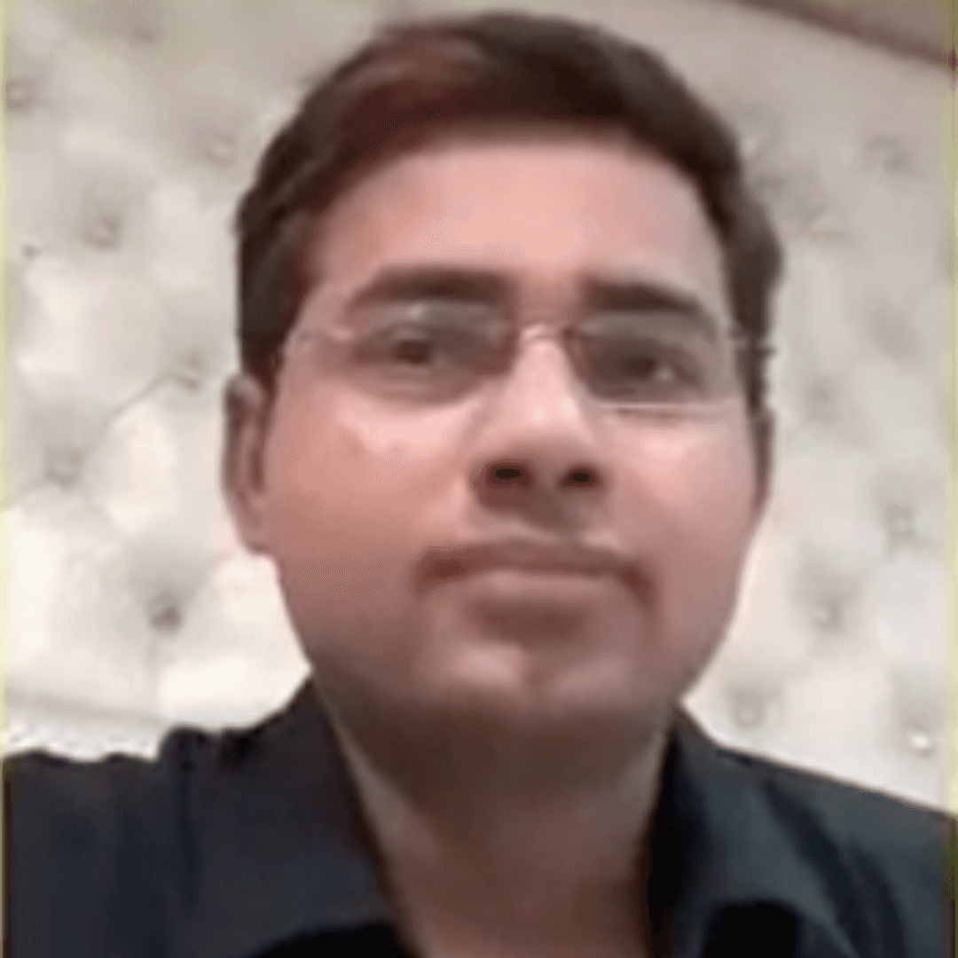 a person sitting at a table looking at the phone