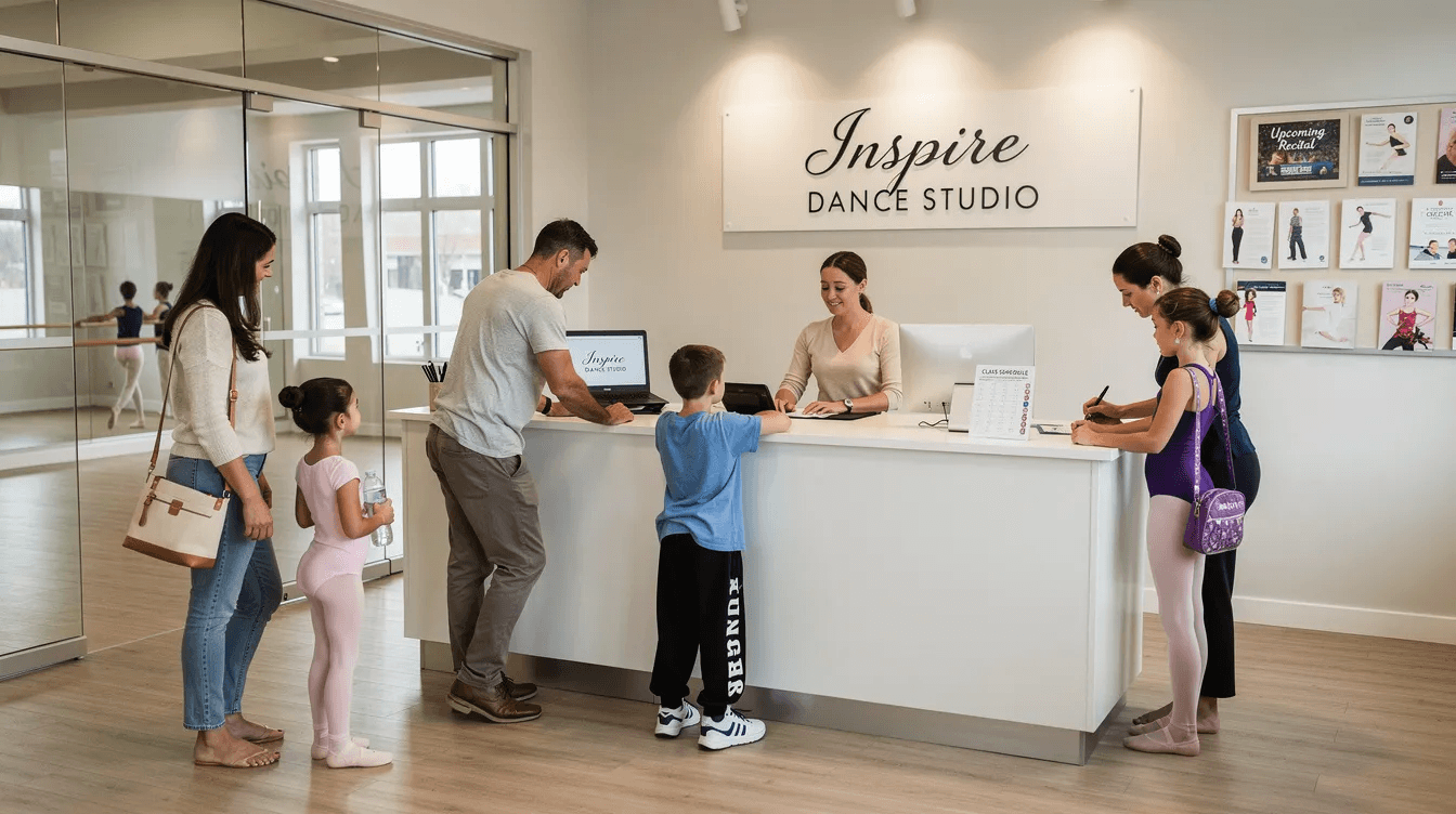The image shows parents with their children checking in at the front desk of a dance studio, where staff members provide excellent customer service and assist with class booking details. This scene highlights the importance of user-friendly dance studio management software that can streamline payment processes and enhance the overall experience for families.