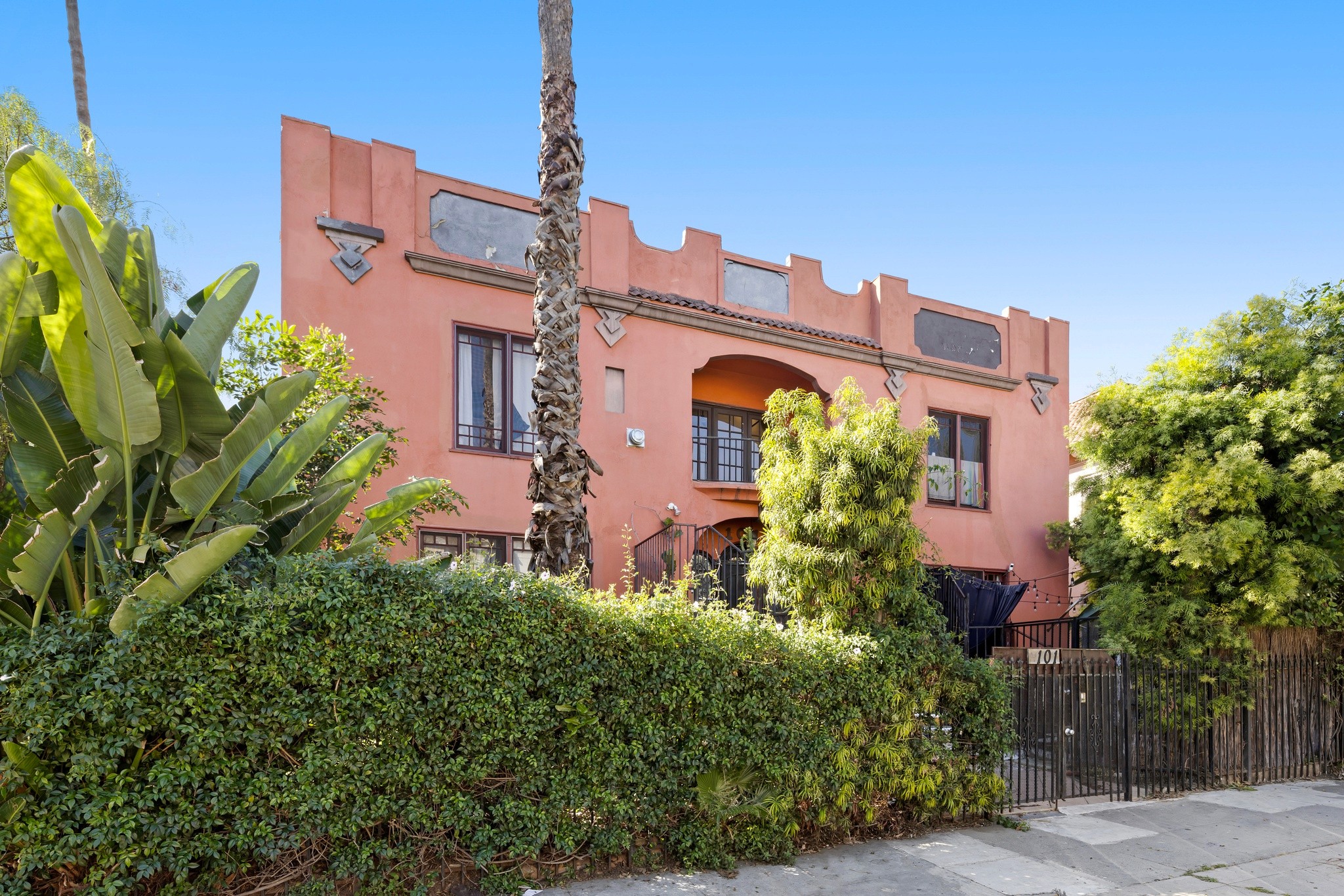 Angled exterior view with mature landscaping and facade details at 101 N Kenmore Ave.