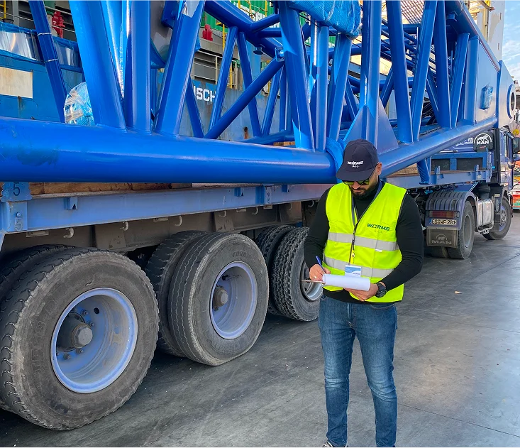 A large boat in the water near a dock